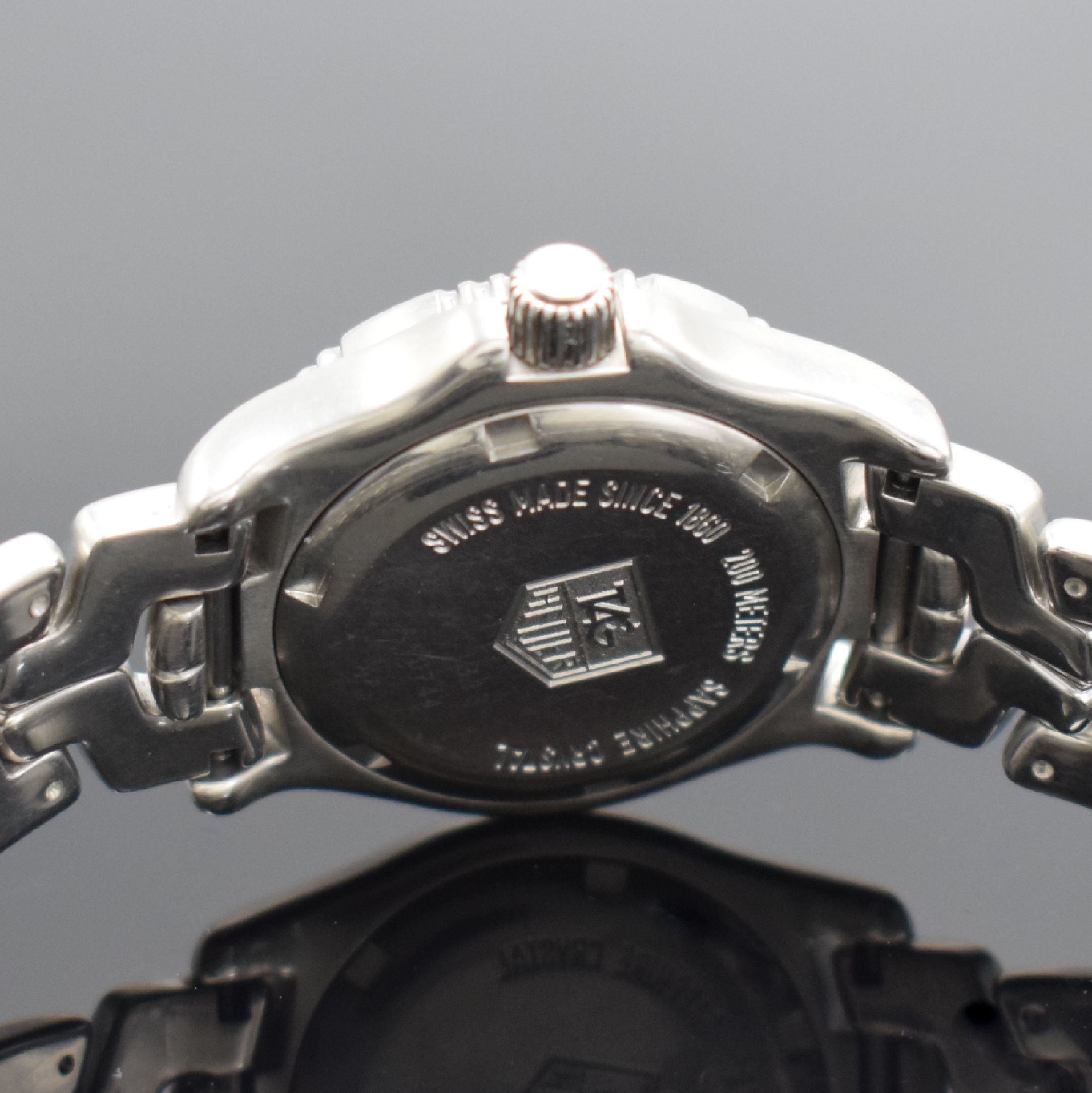 Detail d: TAG HEUER Professional Damenarmbanduhr, Schweiz um 2000, Edelstahlgeh. inkl. Gliederband m. Faltschl., Saphirglas, quarz, Boden & Krone verschr., ab ...