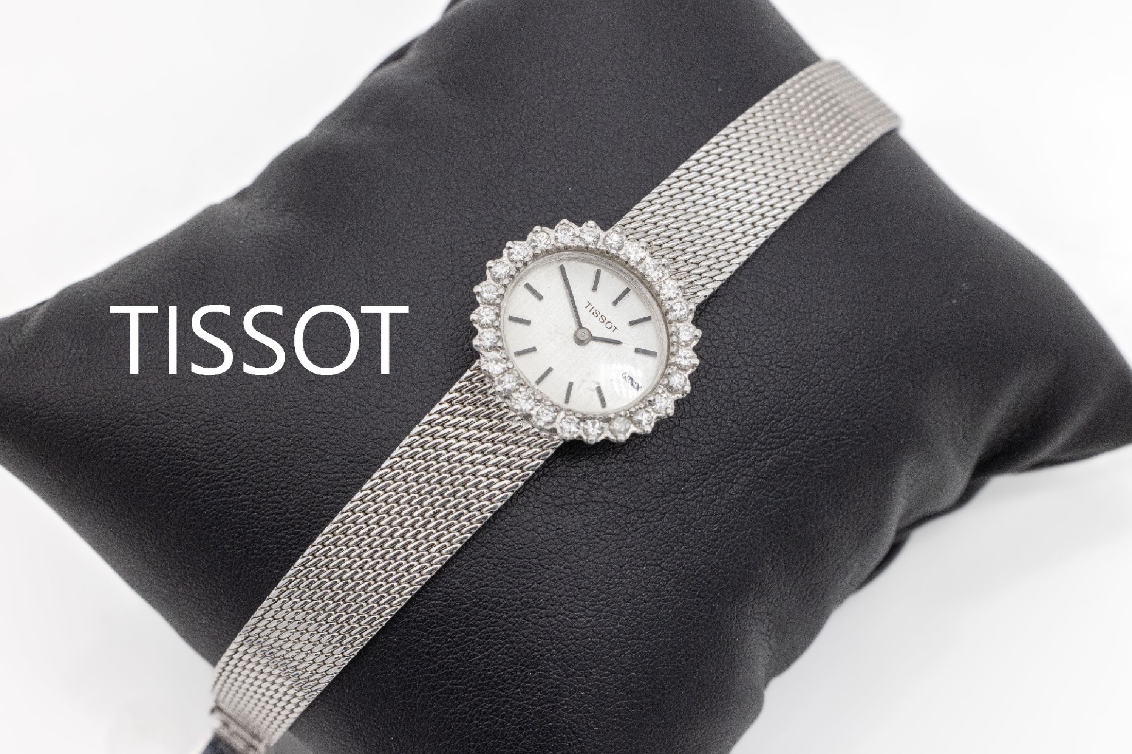 14 kt Gold Tissot Damenschmuckuhr, WG 585/000, 25 Brillanten zus. ca. 1.0 ct Weiß/si, Handaufzug, L. ca. 15.5 bzw. 16 cm, total ca. 29.2 g