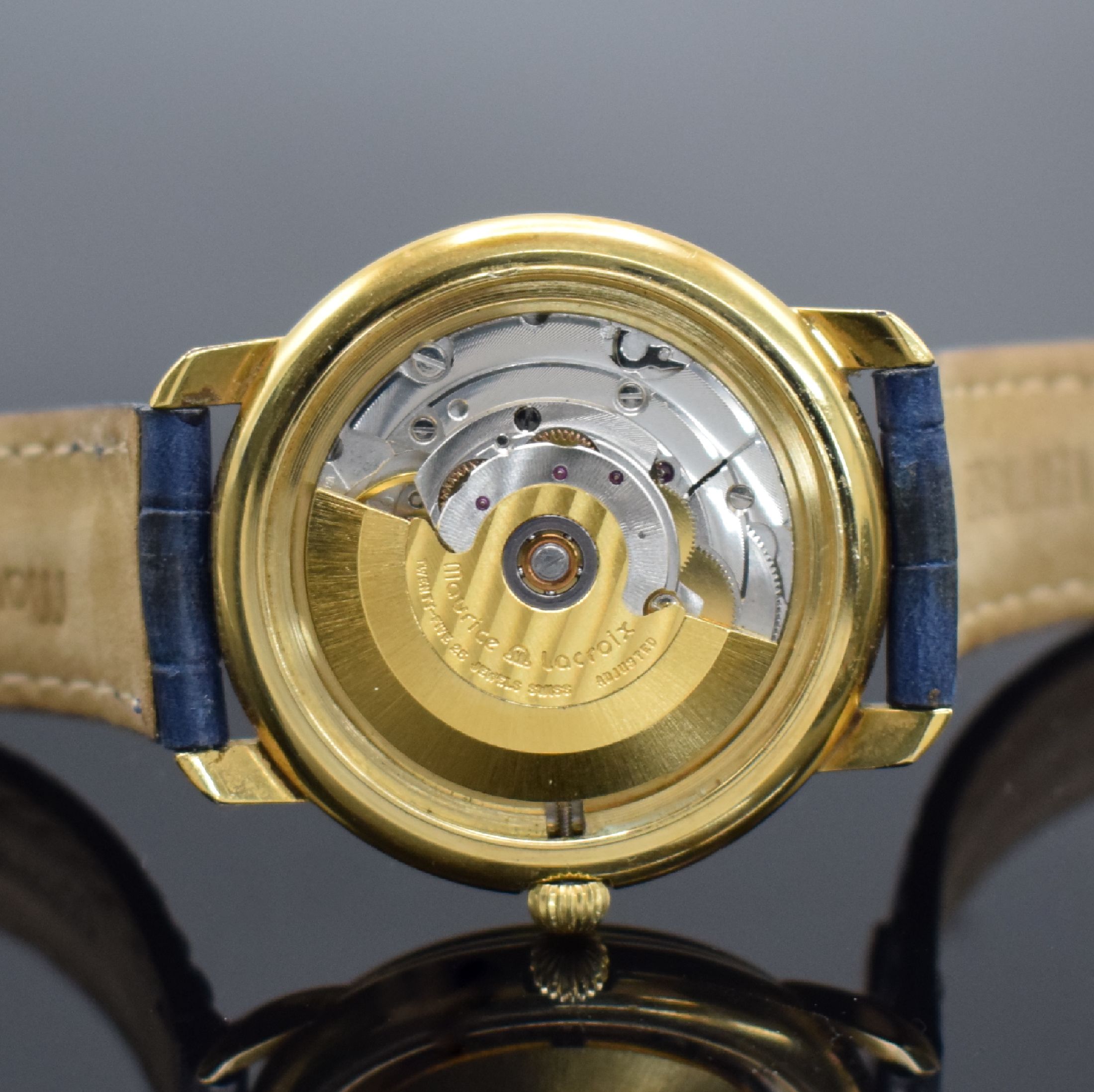Detail e: MAURICE LACROIX vergoldete Herrenarmbanduhr Referenz 09329, Schweiz um 1990, Automatik, Stahlboden aufgedr., orig Lederband m. Dornschl., silb. ...
