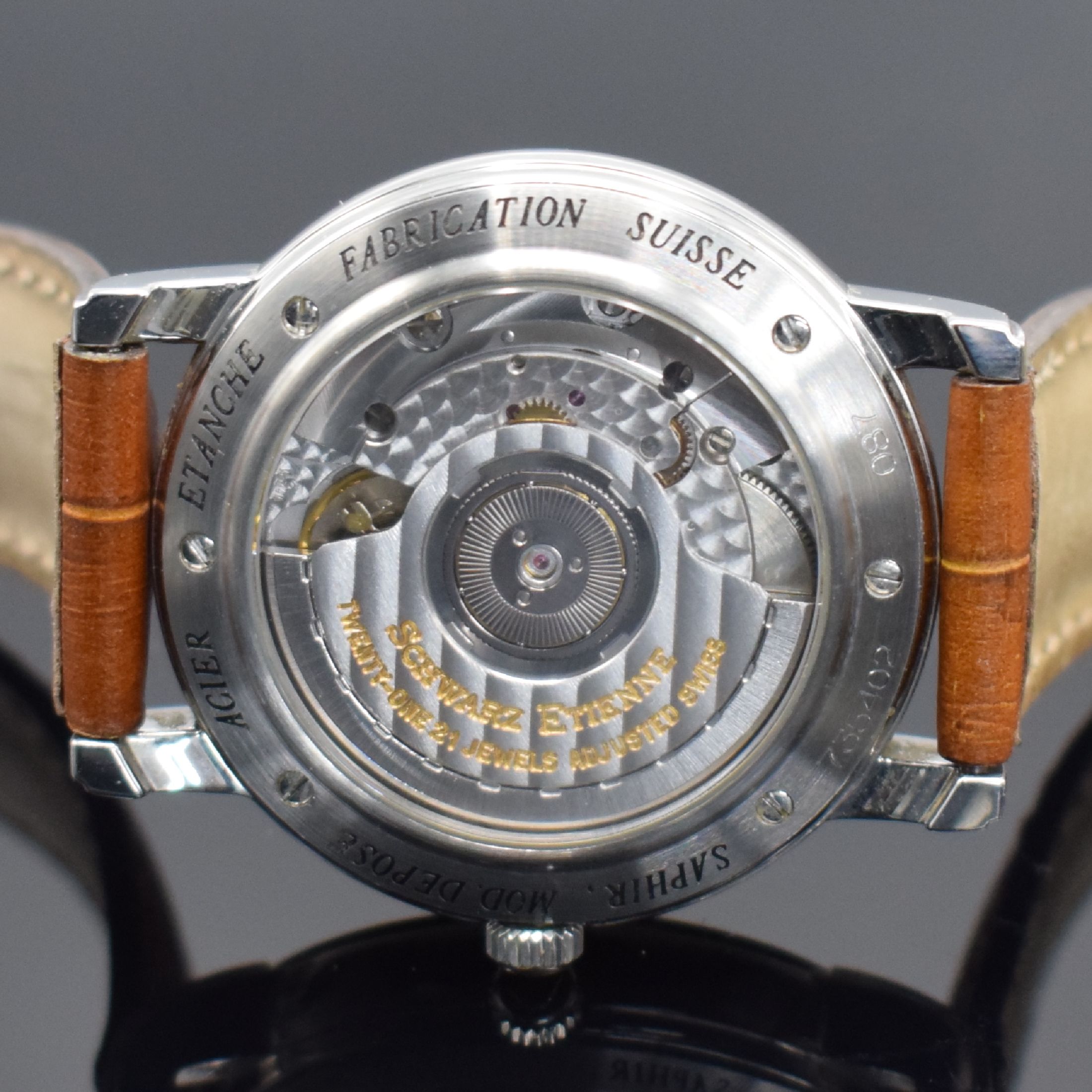 Detail e: SCHWARZ ETIENNE Herrenarmbanduhr mit Datum & Gangreserveanzeige, Schweiz um 1995, Automatik, beids. vergl. Edelstahlgeh., Boden 6-fach verschr., ...