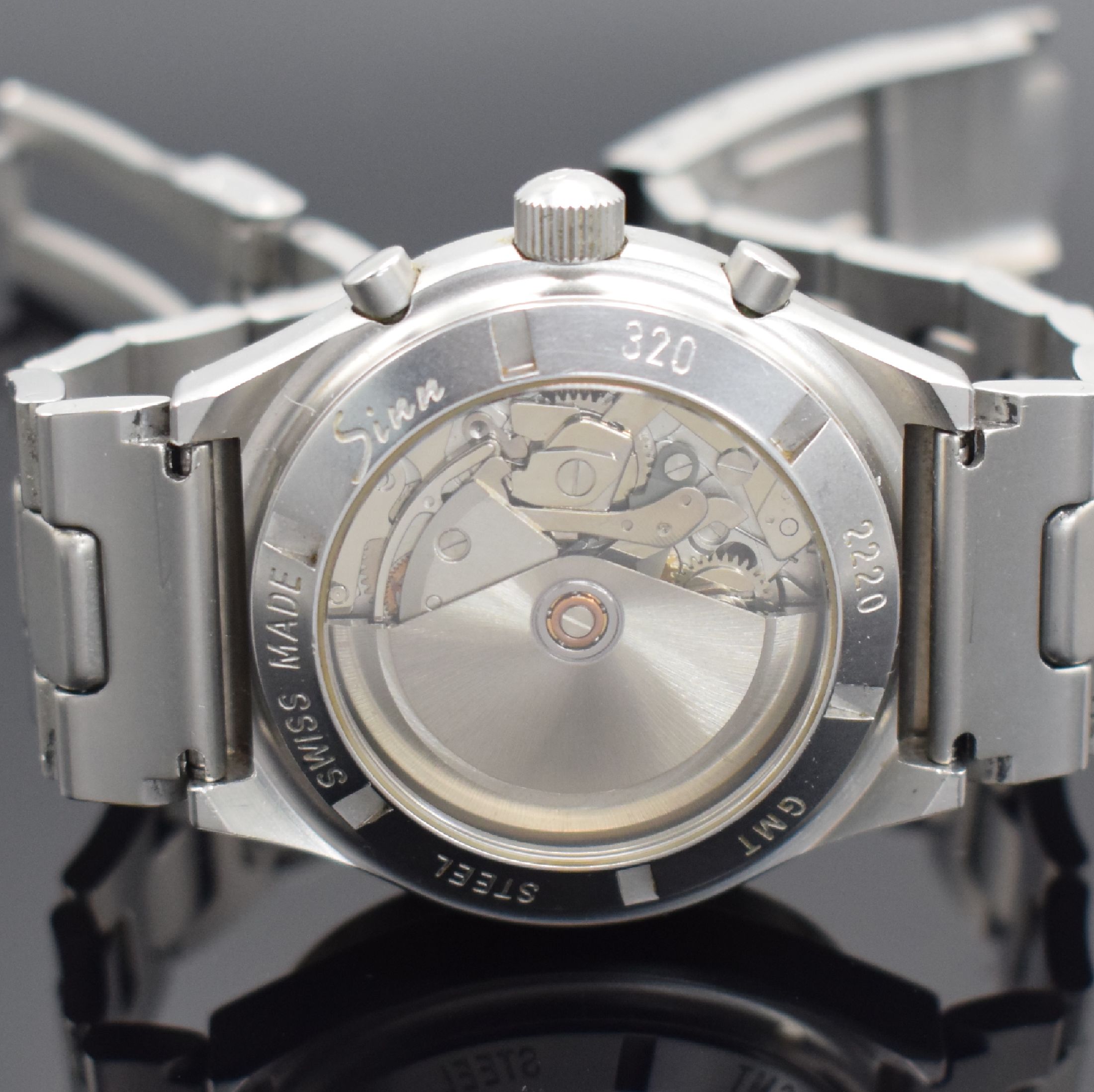 Detail d: SINN Armbandchronograph mit 2. Zeitzone Modell 144 GMT, Schweiz um 1995, Automatik, matt. Edelstahlgeh. inkl. Gliederband m. Faltschl., beids. ...