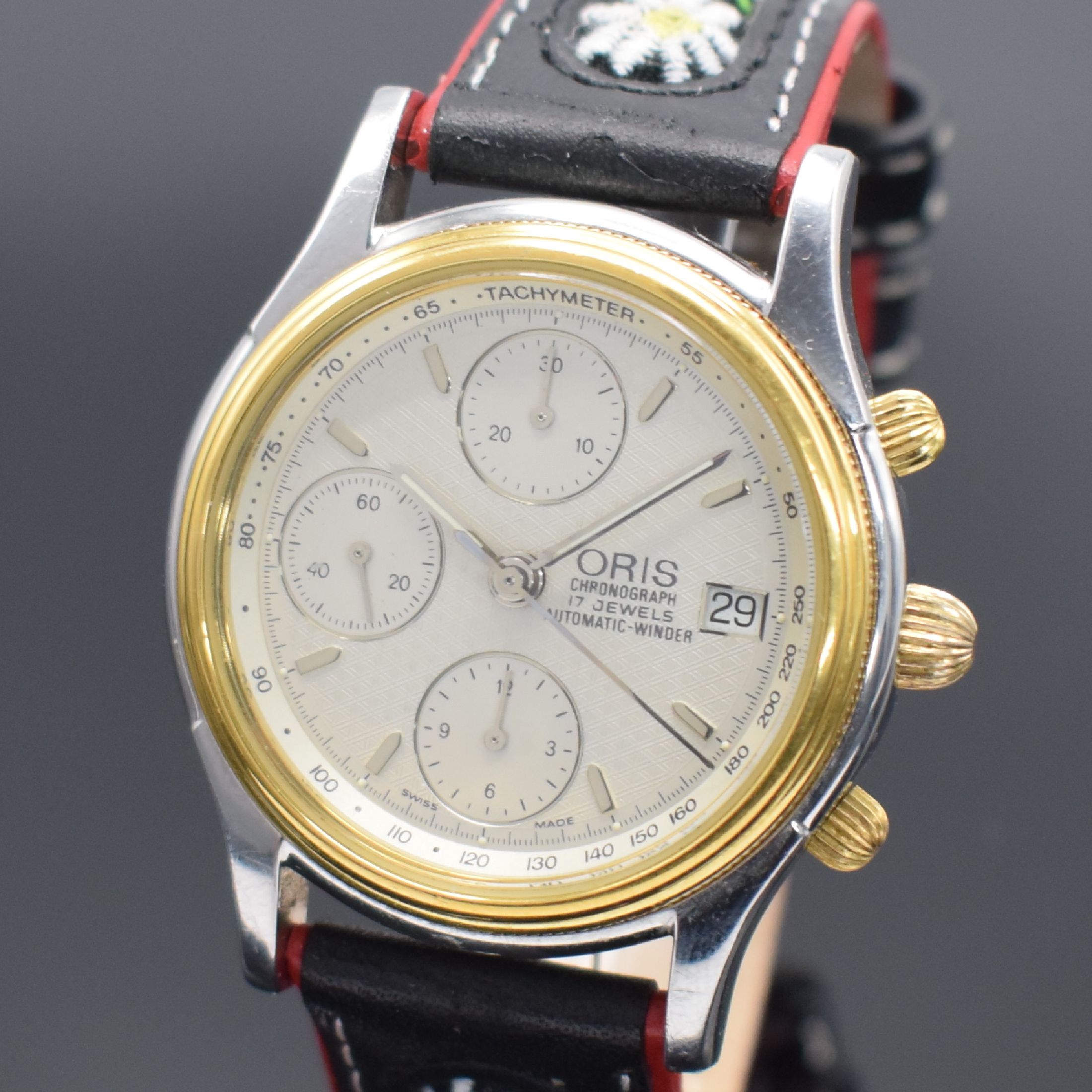 Detail a: ORIS Herrenarmbanduhr mit Chronograph, Schweiz um 1993, Automatik, Edelstahlgeh. teils verg., Boden geschr., silb. Zifferbl. m. aufges. Std.-Ind., ...