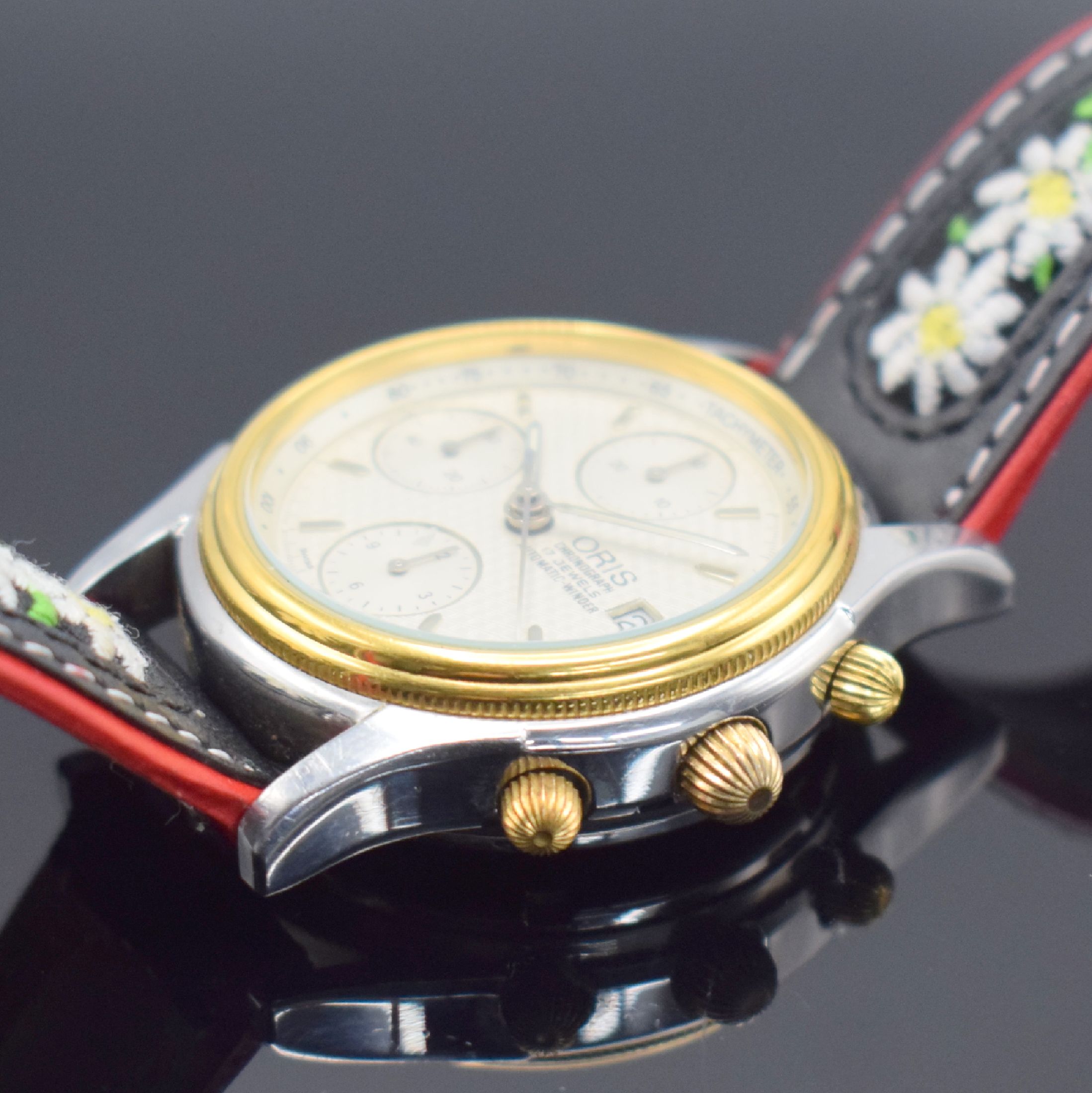 Detail b: ORIS Herrenarmbanduhr mit Chronograph, Schweiz um 1993, Automatik, Edelstahlgeh. teils verg., Boden geschr., silb. Zifferbl. m. aufges. Std.-Ind., ...
