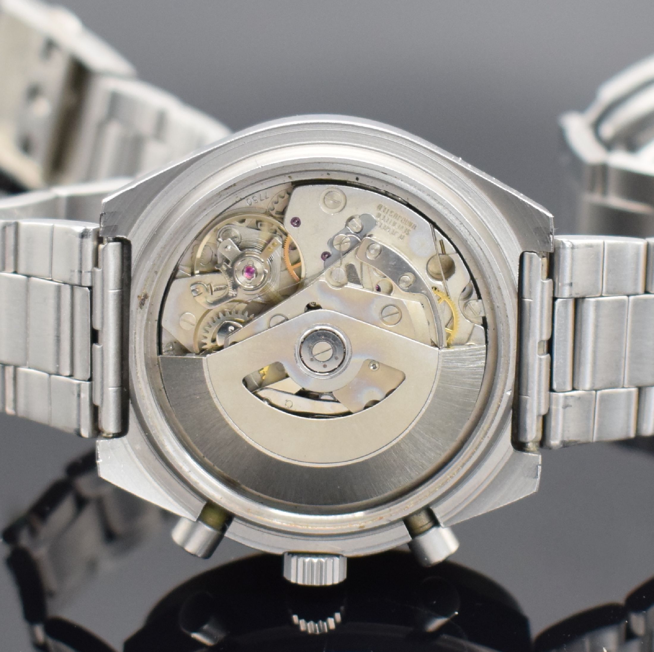 Detail e: MEISTER-ANKER Herrenchronograph in Stahl, Schweiz um 1980, Automatik, mattiertes Geh., Boden verschr., Mineralglas besch., schwarzes Zifferbl., ...