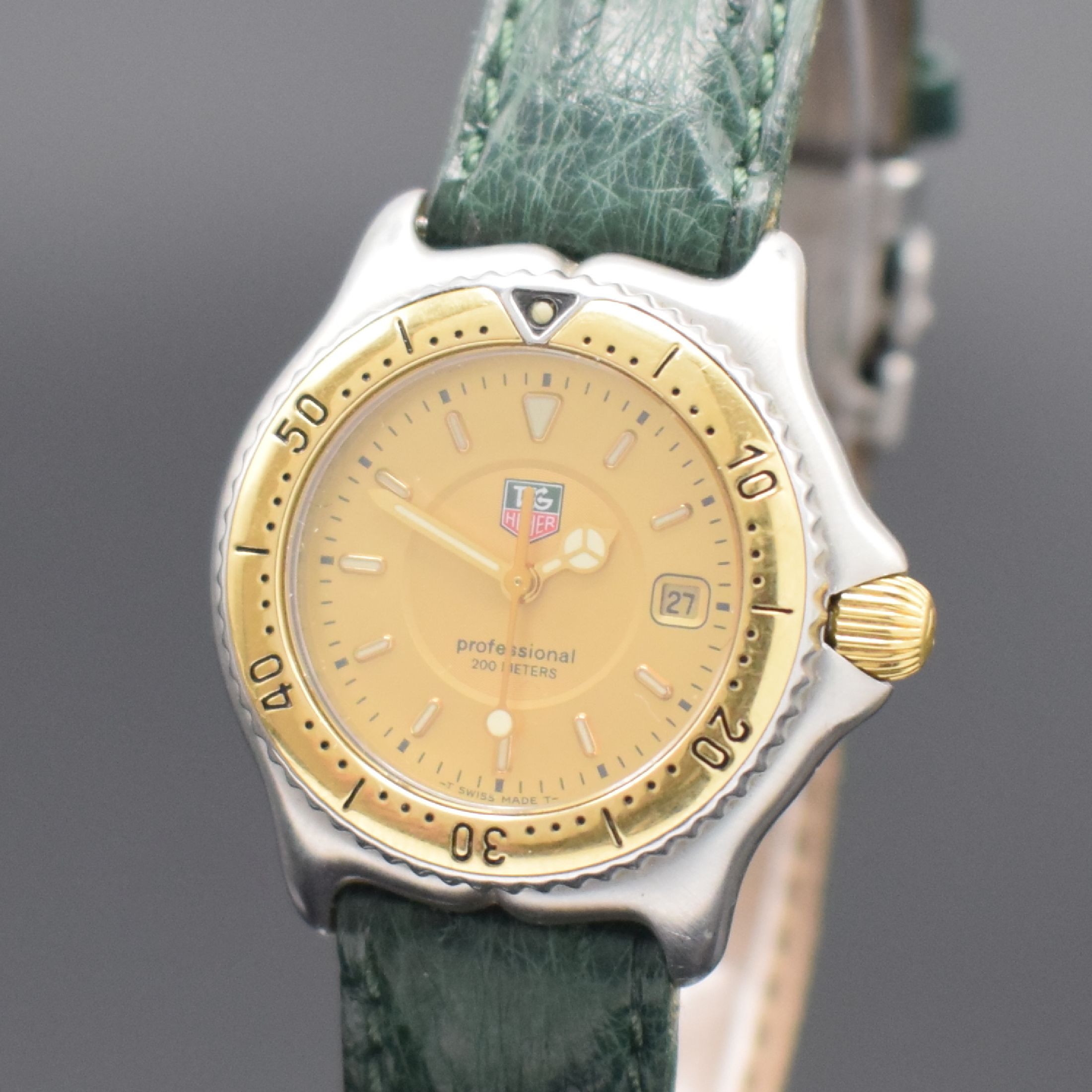Detail a: TAG HEUER Damen-Sportuhr in Stahl/Gold Referenz WI 1351, Schweiz um 2000, quartz, verschr. Geh., eins. drehbare Lünette m. 60er-Tlg., gold. ...
