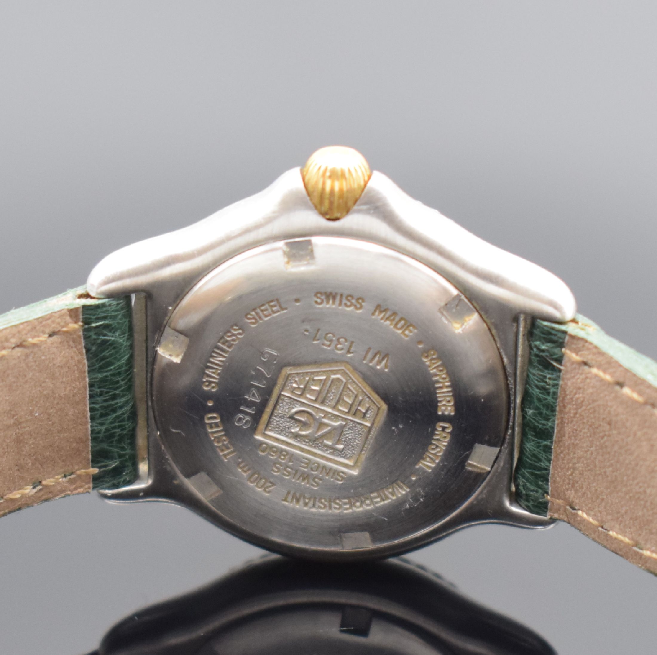 Detail d: TAG HEUER Damen-Sportuhr in Stahl/Gold Referenz WI 1351, Schweiz um 2000, quartz, verschr. Geh., eins. drehbare Lünette m. 60er-Tlg., gold. ...
