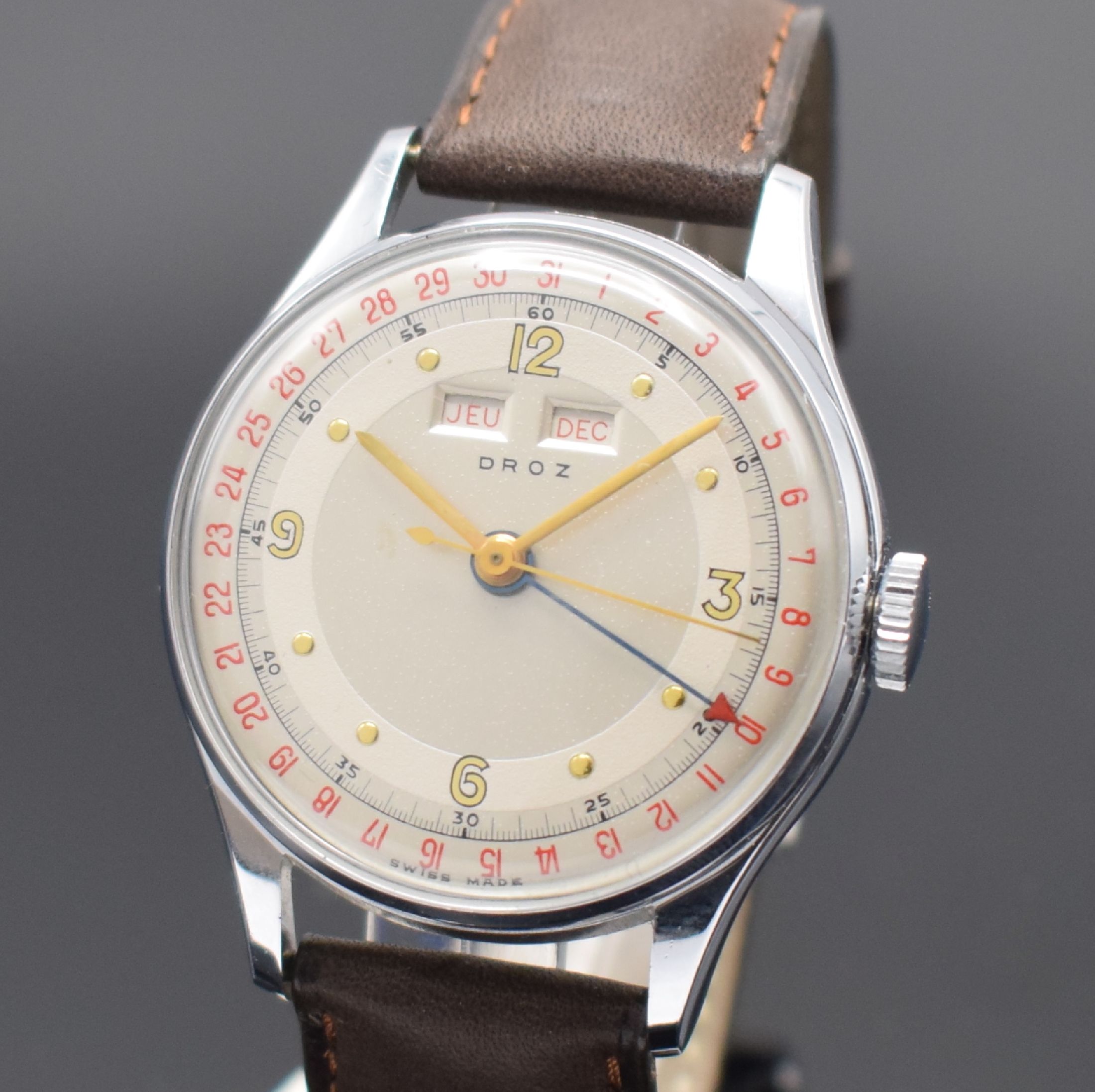 Detail a: DROZ Valjoux 90 Herrenarmbanduhr mit Vollkalender, Schweiz um 1950, Handaufzug, verchr. Geh., gedr. Stahlboden, seitl. Korrekturdrücker, silb. ...