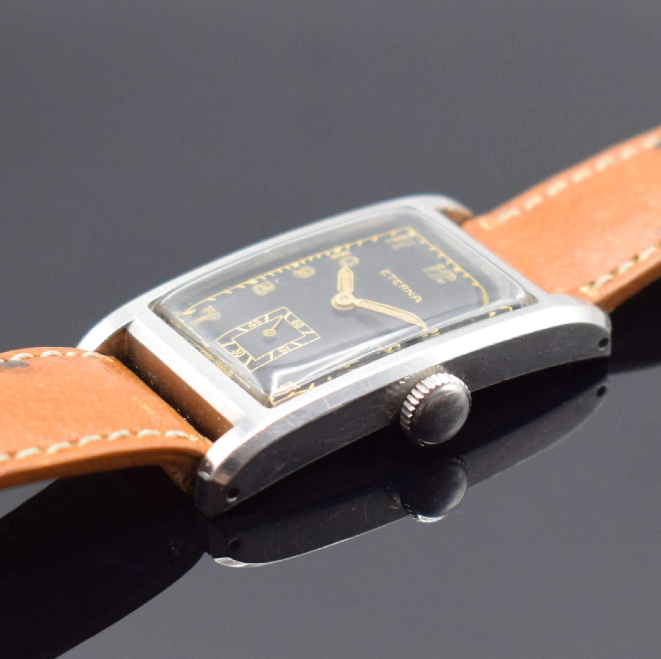 Detail b: ETERNA seltene rechteckige Armbanduhr mit verschraubtem Boden in Stahl, Schweiz um 1940, Handaufzug, 2-tlg. Geh., Boden 4-fach verschr., schwarzes ...