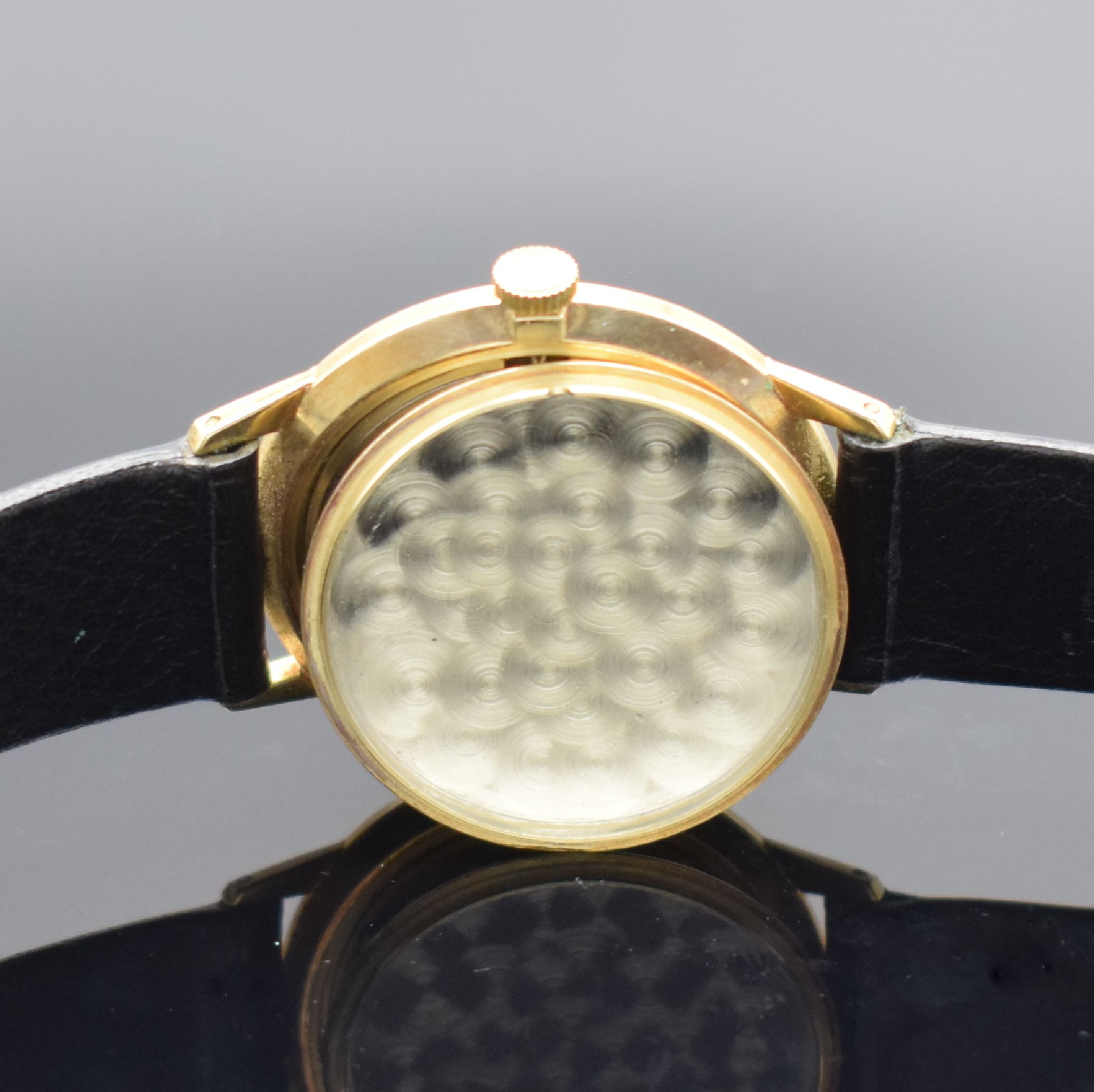 Detail e: JUNGHANS Herrenarmbanduhr in GG 585/000, Deutschland 1970er Jahre, Handaufzug, Boden aufgedr., silb. Zifferbl. m. aufges. Std.- Ind., gold. Zeiger, ...