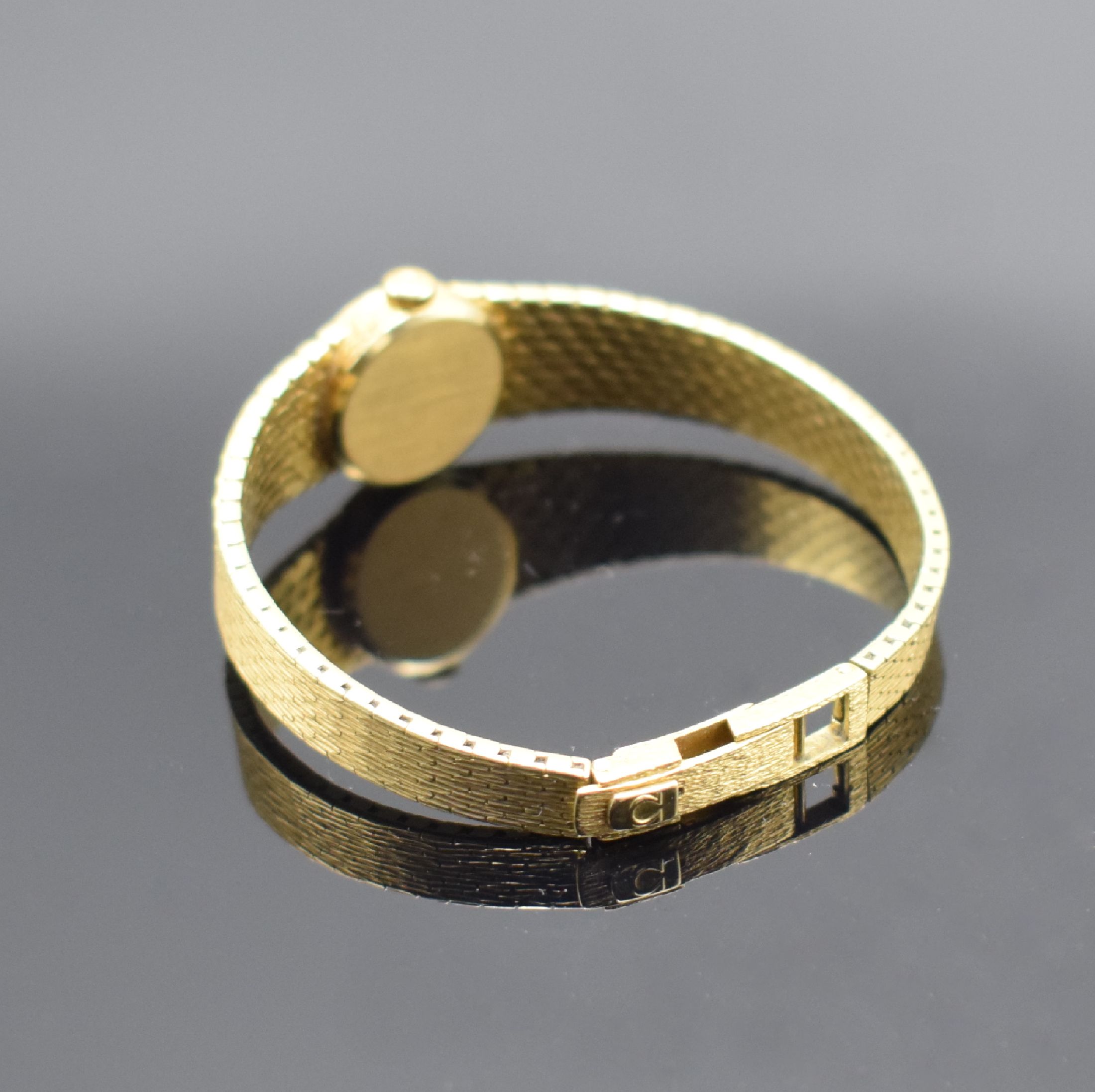 Detail b: OMEGA De Ville Damenarmbanduhr in GG 750/000, Schweiz um 1969, Handaufzug, Geh. an Goldband 750/000, Boden aufgedr., goldfarb. Zifferbl. m. aufgel. ...