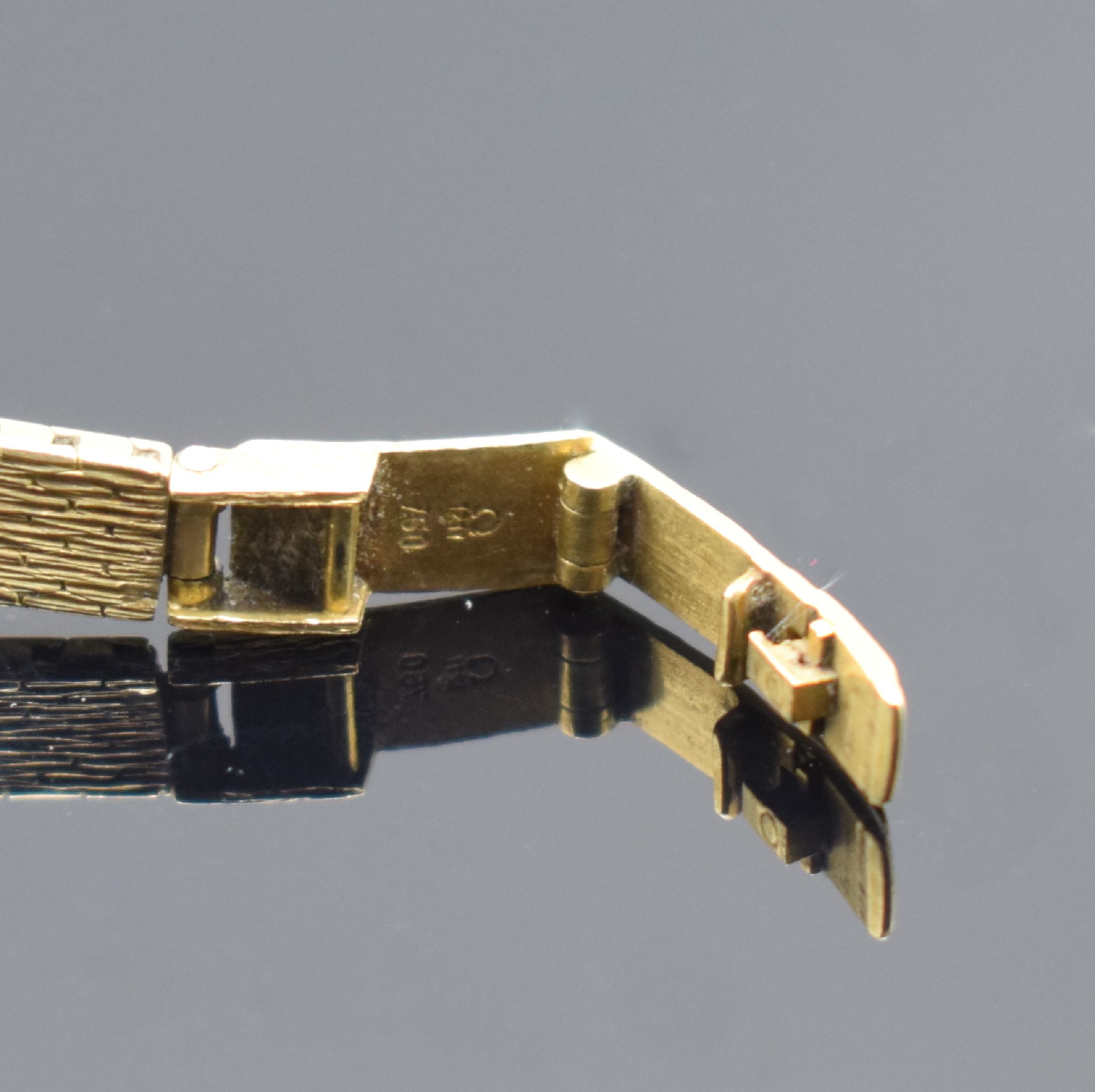 Detail c: OMEGA De Ville Damenarmbanduhr in GG 750/000, Schweiz um 1969, Handaufzug, Geh. an Goldband 750/000, Boden aufgedr., goldfarb. Zifferbl. m. aufgel. ...