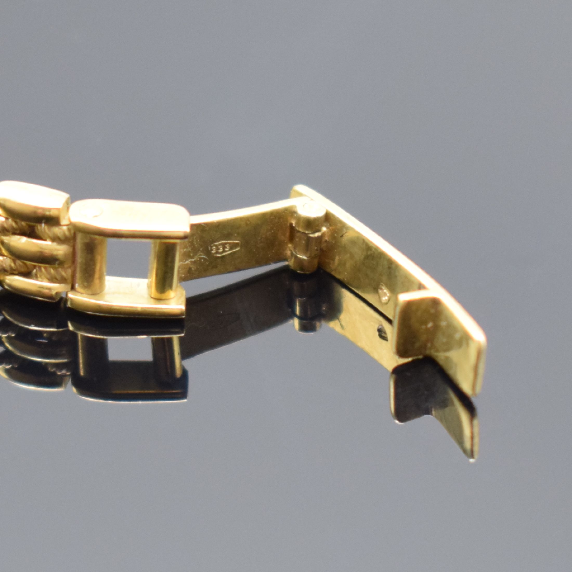 Detail b: DE LUXE Quartz Damenarmbanduhr in GG 333/000, Schweiz um 2000, Geh. an Goldband 333/000, Boden aufgedr., champagnerfarb. Zifferbl. m. gold. ...