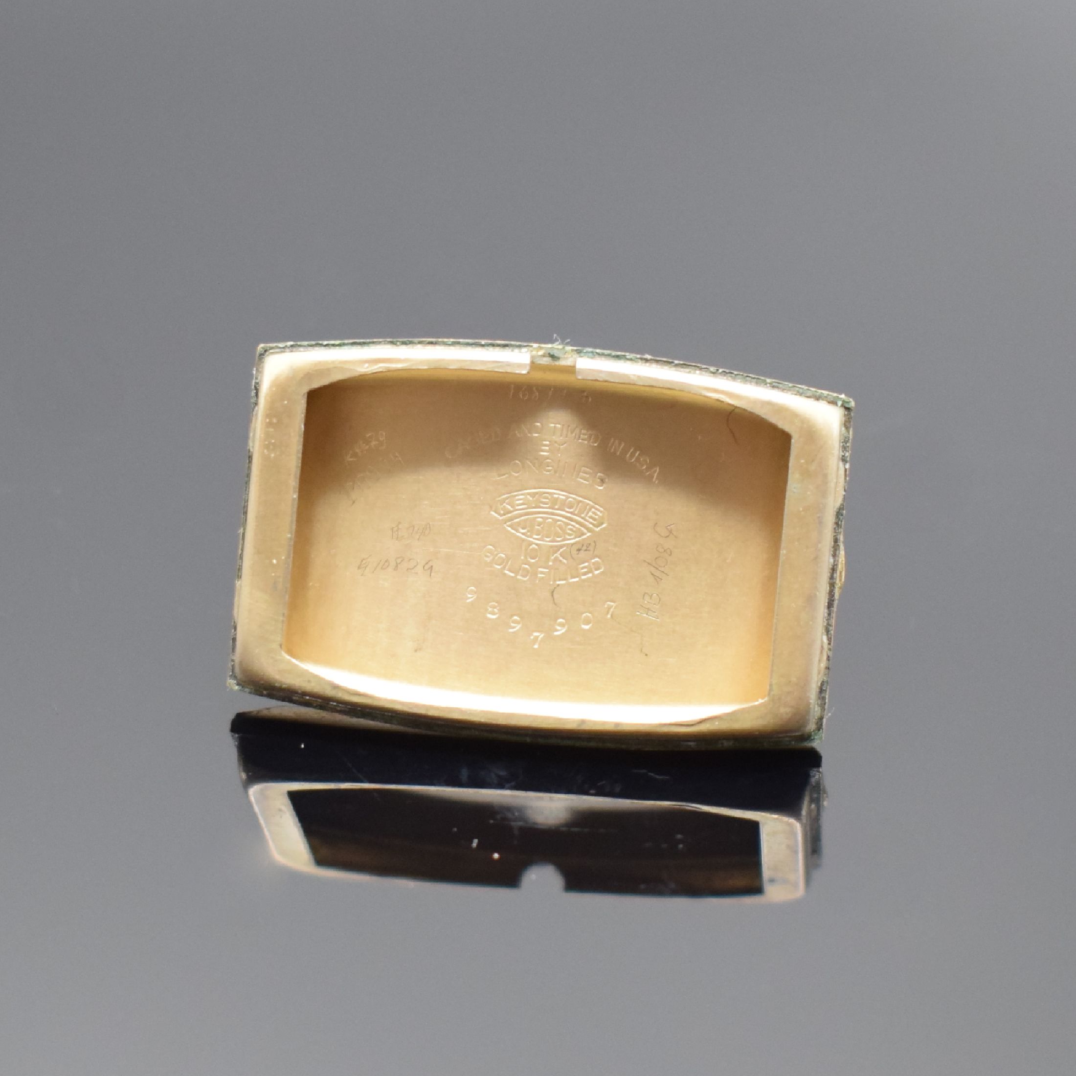 Detail d: LONGINES tonneauförmige, 10k Gold filled Armbanduhr, Schweiz/USA um 1937, Handaufzug, 2-teil. Geh., Boden aufgedr., silb. Zifferbl. altersbed. ...