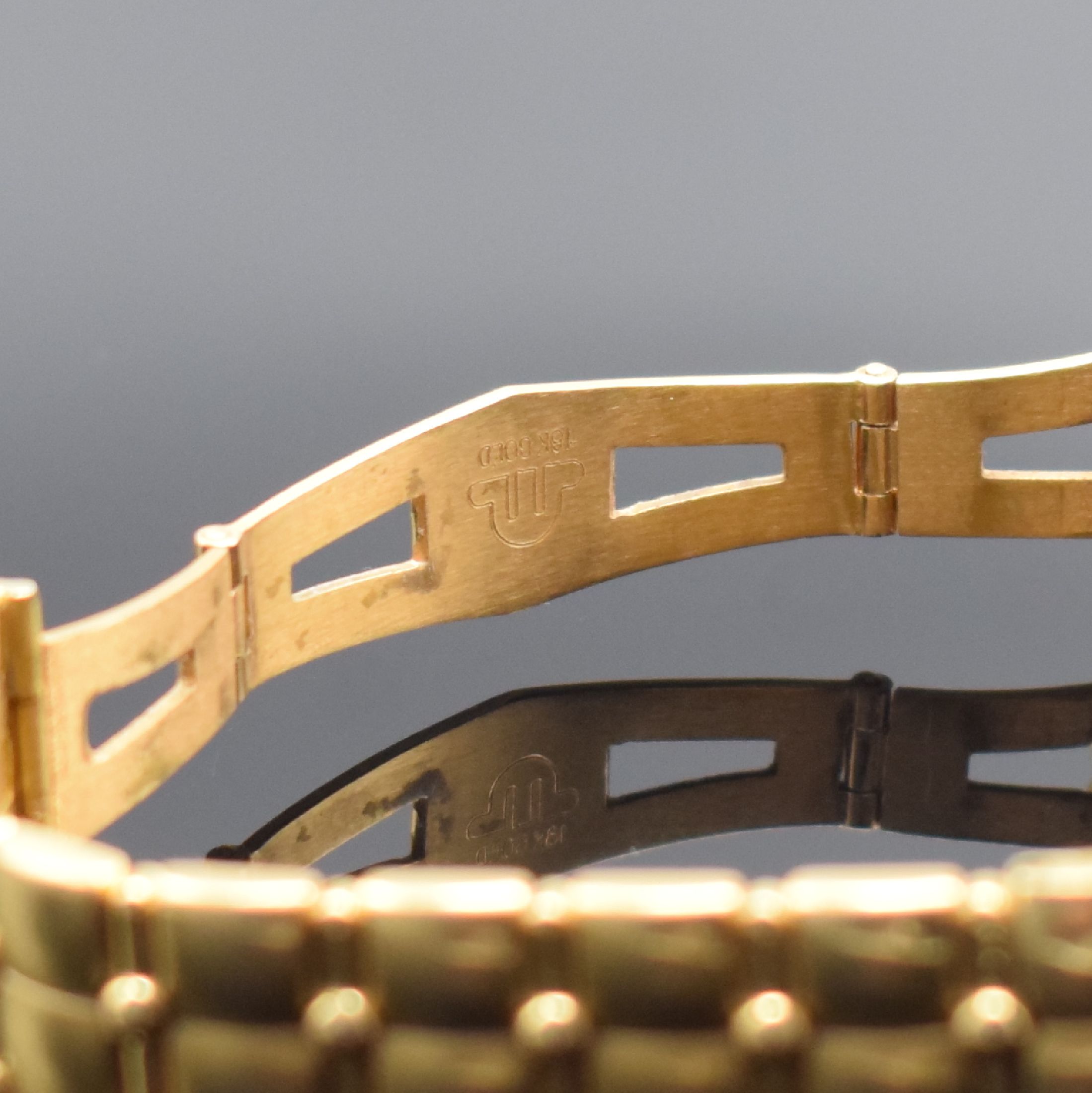 Detail c: MAURICE LACROIX Herrenarmbanduhr in GG 750/000, quarz, Schweiz um 1995, massives Geh. inkl. Gliederband m. dopp. Faltschl., Boden aufgedr., ...