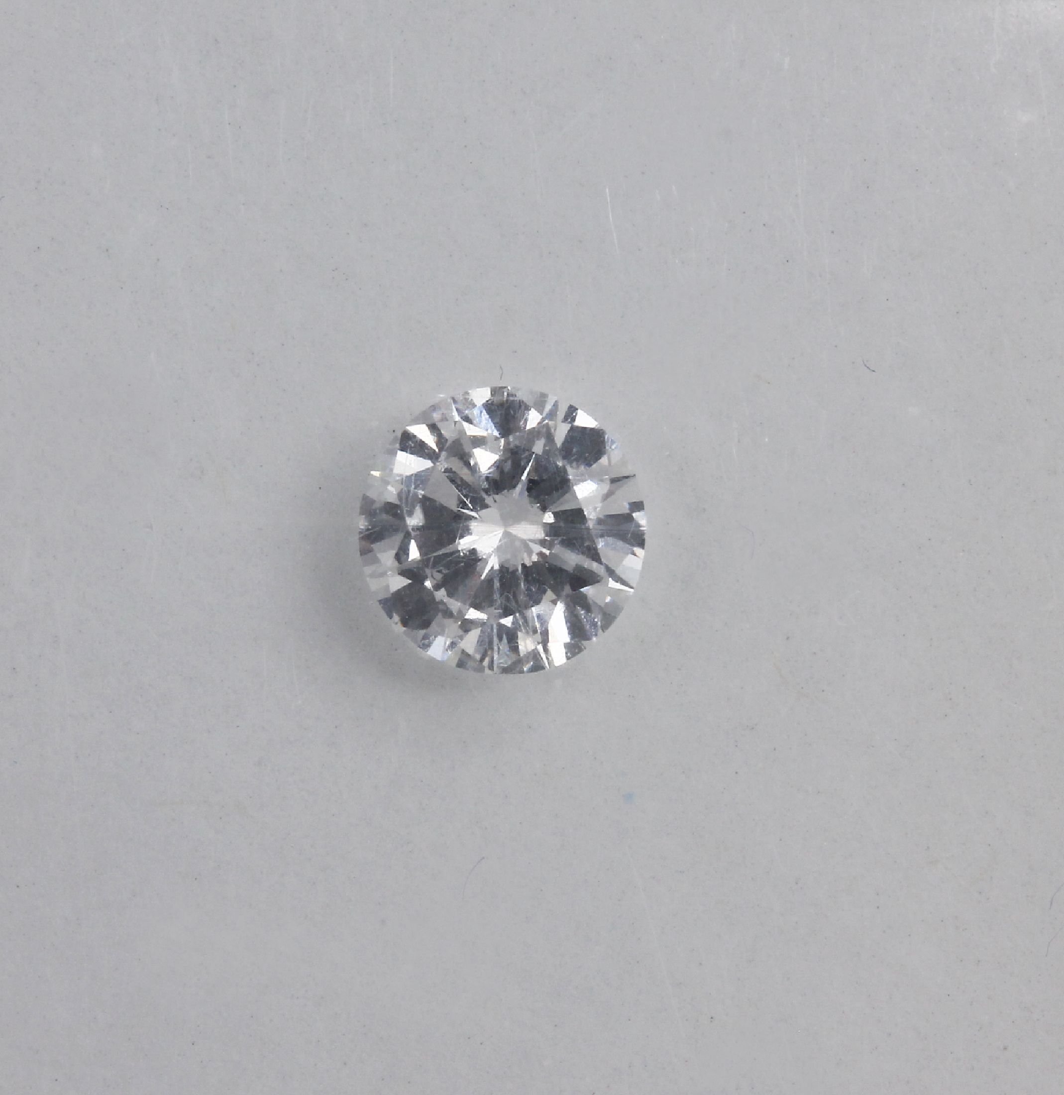 Detail a: Eingeschweißter Brillant 0.53 ct Weiß (G)/ lupenrein, IGI-Blister
