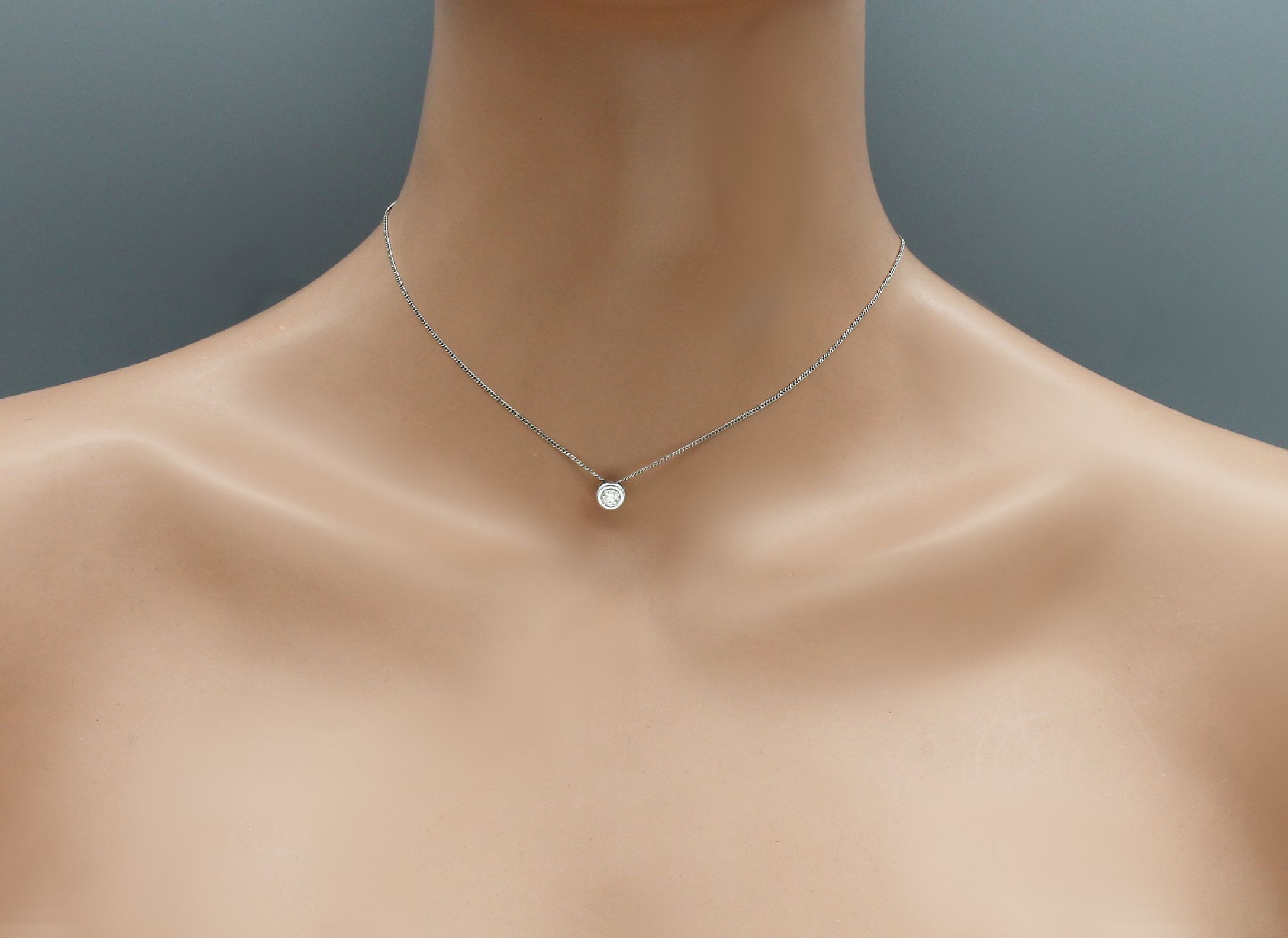 Detail c: 14 kt Gold Brillant-Anhänger, WG 585/000, Brillant ca. 0.25 ct Weiß/lr-si, an Kette, L. ca. 38 cm, total ca. 2.1 g