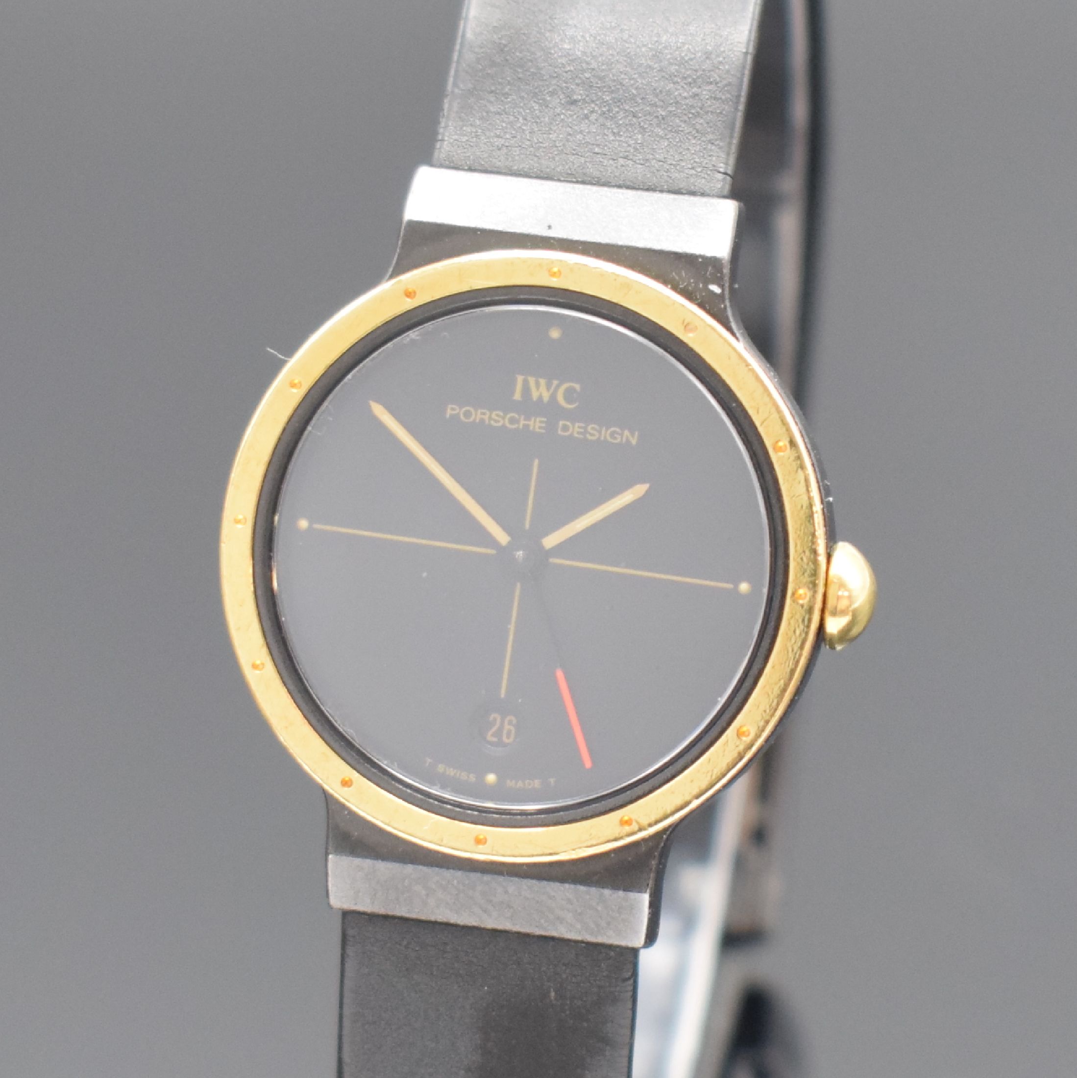 Detail a: IWC / PORSCHE DESIGN Damenarmbanduhr, Schweiz um 1990, quarz, geschw. Geh. inkl. Kautschukband m. Faltschl., Goldlünette, Boden verschr., schwarzes ...