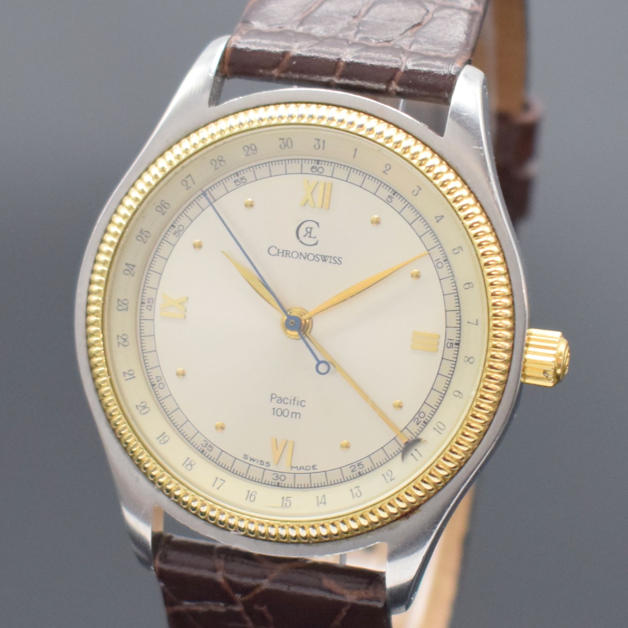 Detail a: CHRONOSWISS Herrenarmbanduhr Pacific Referenz CH 2214, Schweiz um 1990, Automatik, Edelstahl/Gold komb., beids. vergl., Boden & Krone verschr., silb. ...