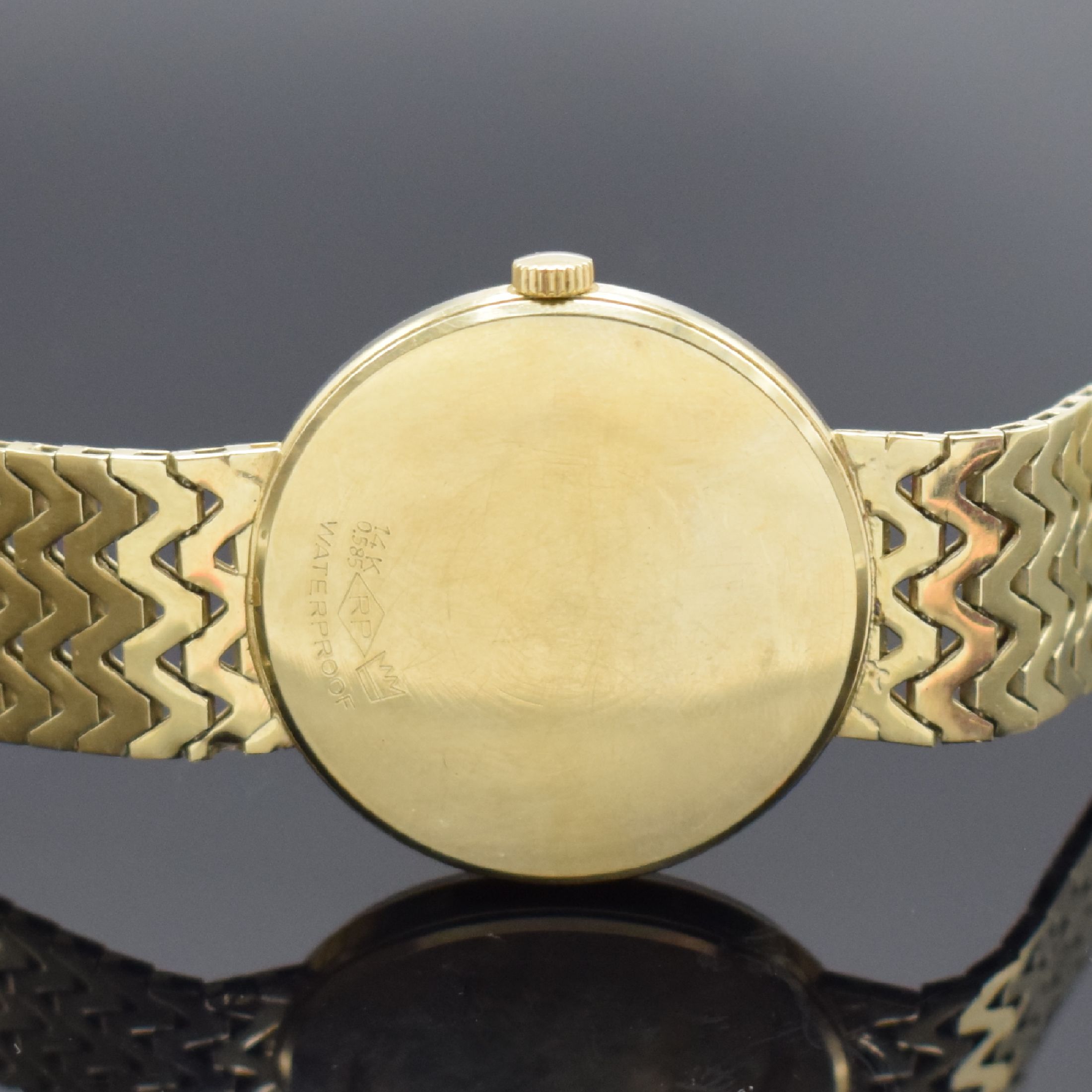 Detail d: ROXY Armbanduhr in GG 585/000, Handaufzug, Schweiz um 1965, Boden aufgedr., Goldband an der Schließe m. Monogramm BK, champagnerfarb. Zifferbl., ...