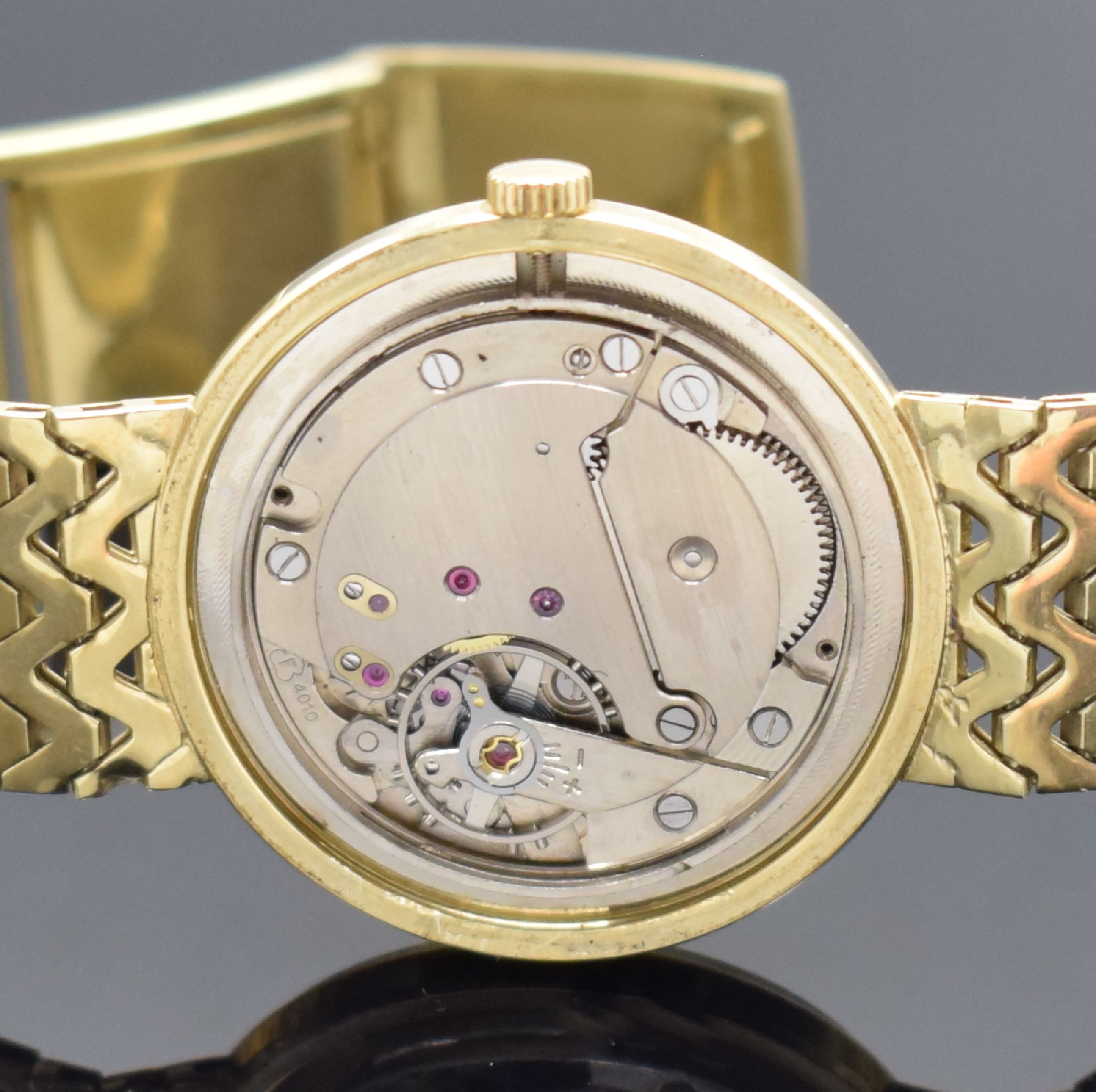 Detail e: ROXY Armbanduhr in GG 585/000, Handaufzug, Schweiz um 1965, Boden aufgedr., Goldband an der Schließe m. Monogramm BK, champagnerfarb. Zifferbl., ...
