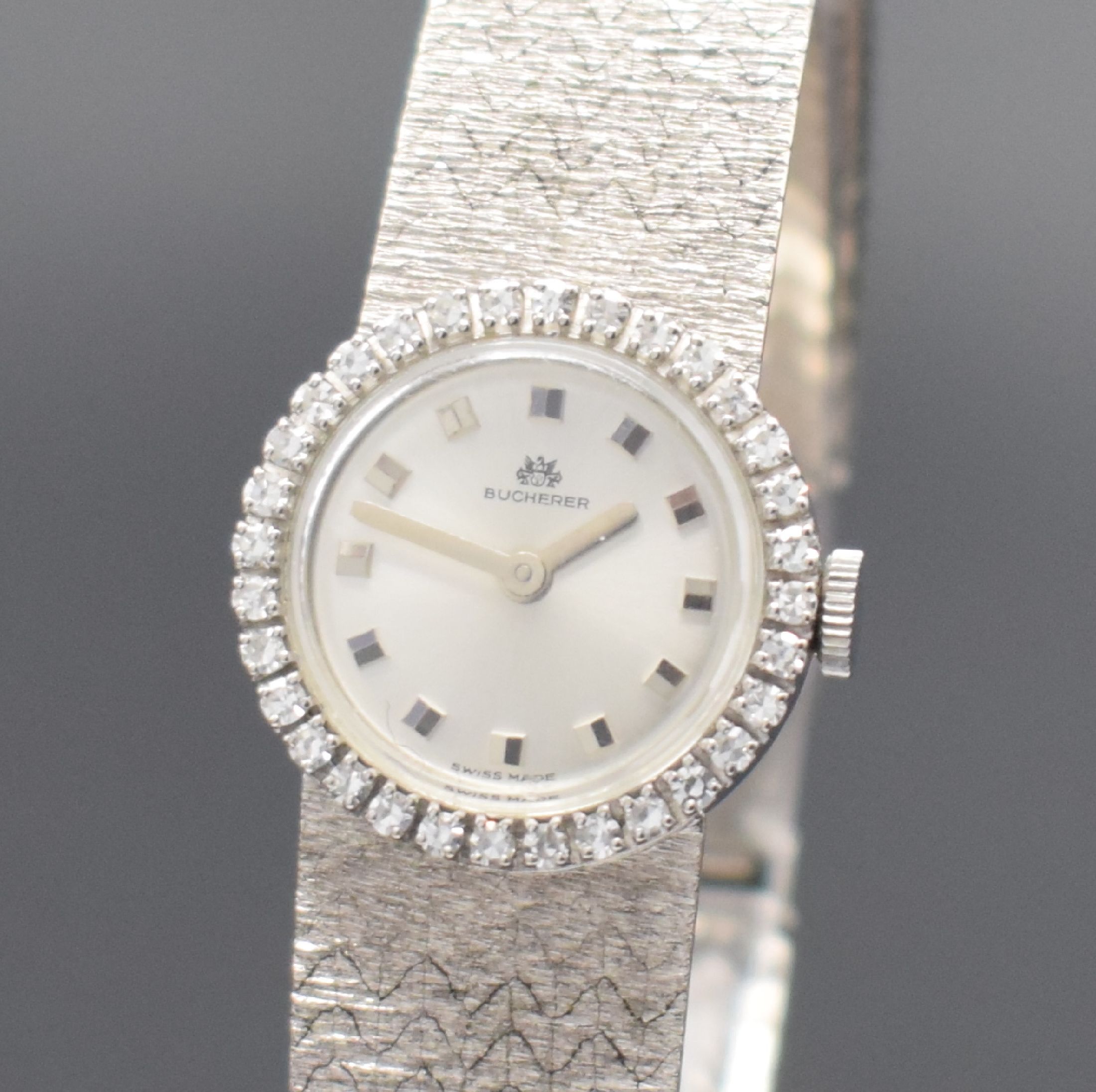 Detail a: BUCHERER Damenarmbanduhr in WG 750/000 mit Diamanten, Schweiz um 1965, Handaufzug, 2- teil. Geh., Boden aufgedr., Lünette m. Diamanten bes., silb. ...