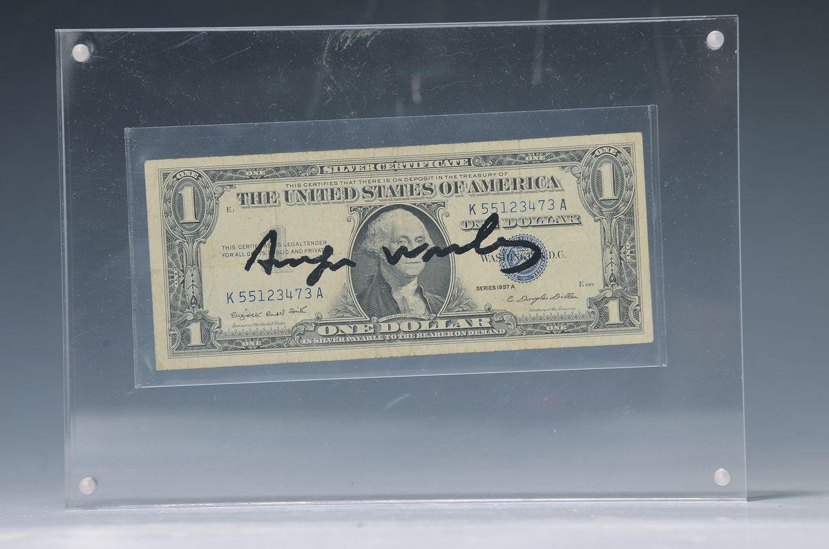 Andy Warhol, 1928-1987, "Dollar", zwischen Plexiglas, dieser mit Magnet befestigt, sign. ca. 6,5x15,5 cm, gesamt ca. 15x20cm, mit ...