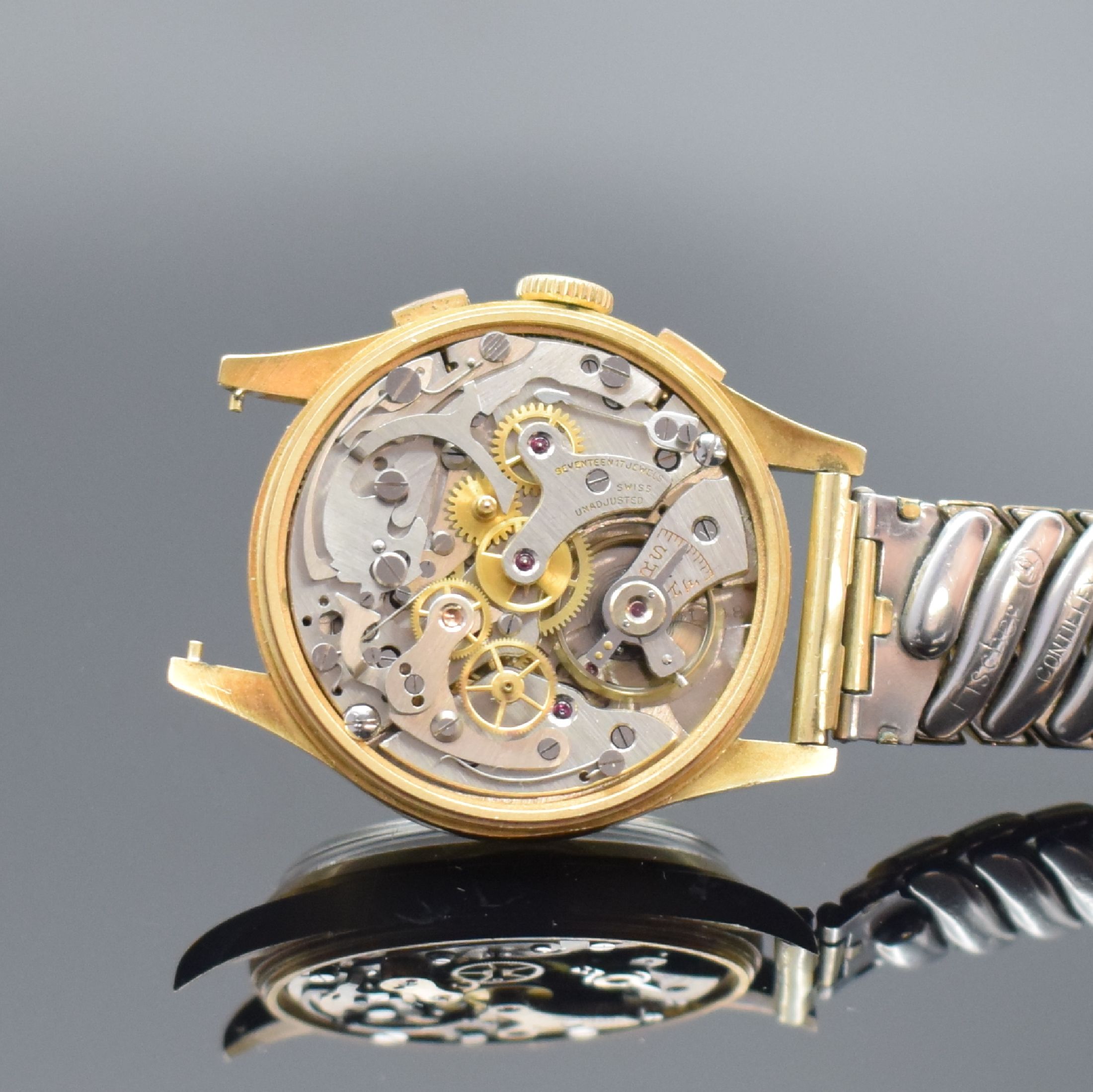 Detail e: ORATOR Herrenarmbanduhr mit Chronograph in GG 750/000, Schweiz um 1955, Handaufzug, 3- teil. Geh., Boden & Glasrand aufgedr., silb. Zifferbl. m. ...