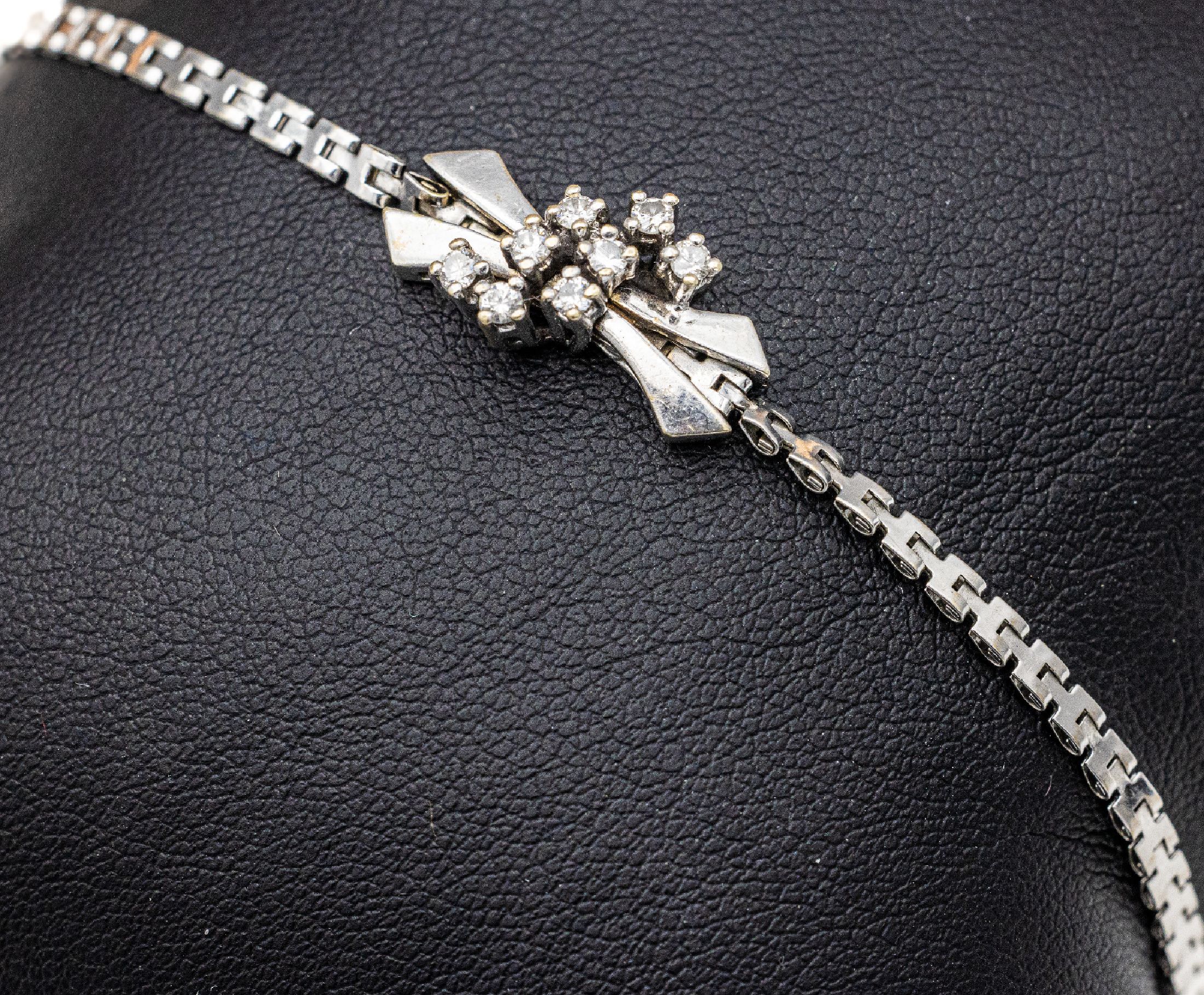 14 kt Gold Brillant-Armband, WG 585/000, 8 Brillanten zus. ca. 0.24 ct Weiß/si, ca. 4.5 g, L. ca. 18.5 cm, Kastenschloss mit Sicherheitsacht