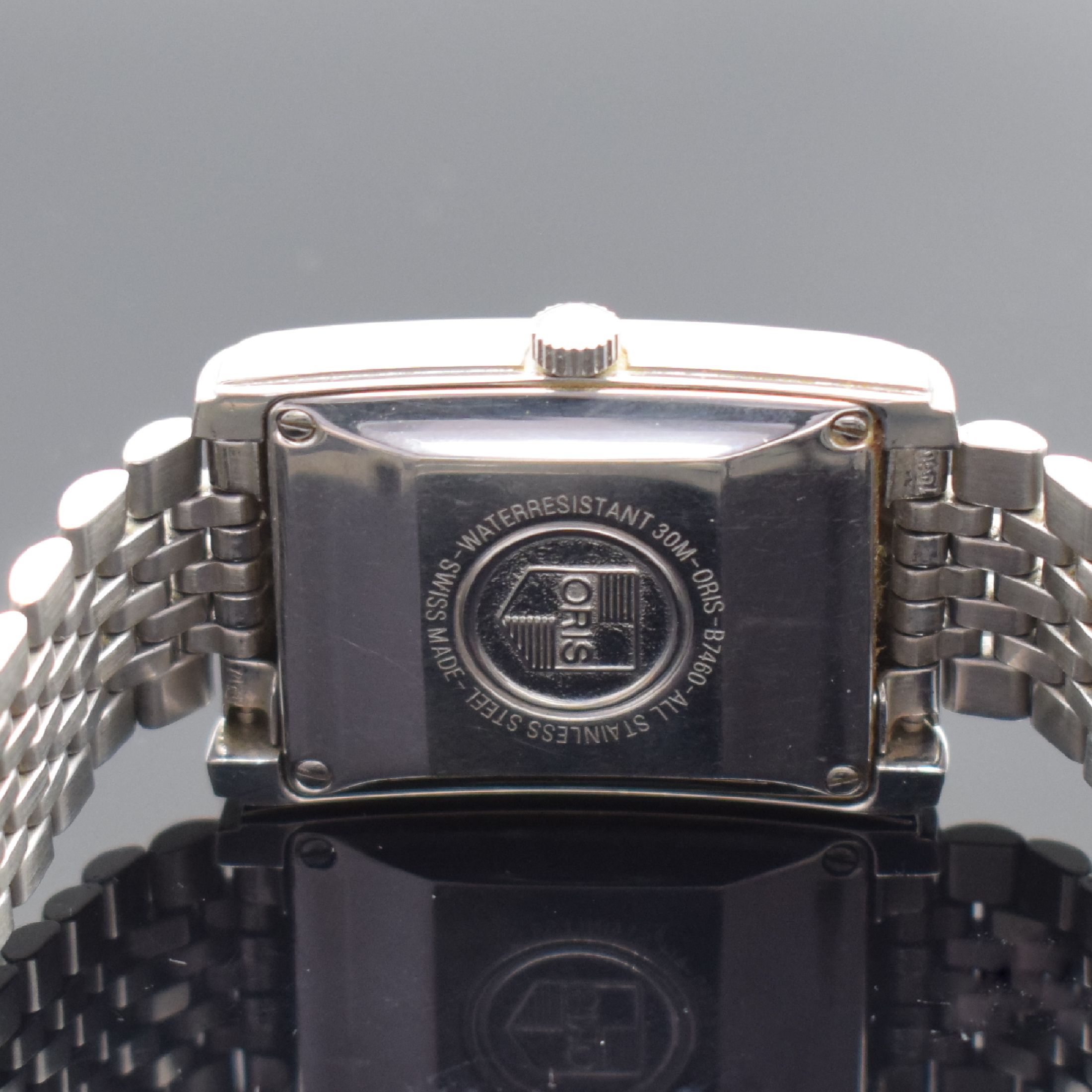 Detail d: ORIS rechteckige Herrenarmbanduhr min Edelstahl Referenz B7460, Schweiz um 1995, Boden 4-fach verschr., schwarzes Zifferbl. m. arab. Zahlen, ...