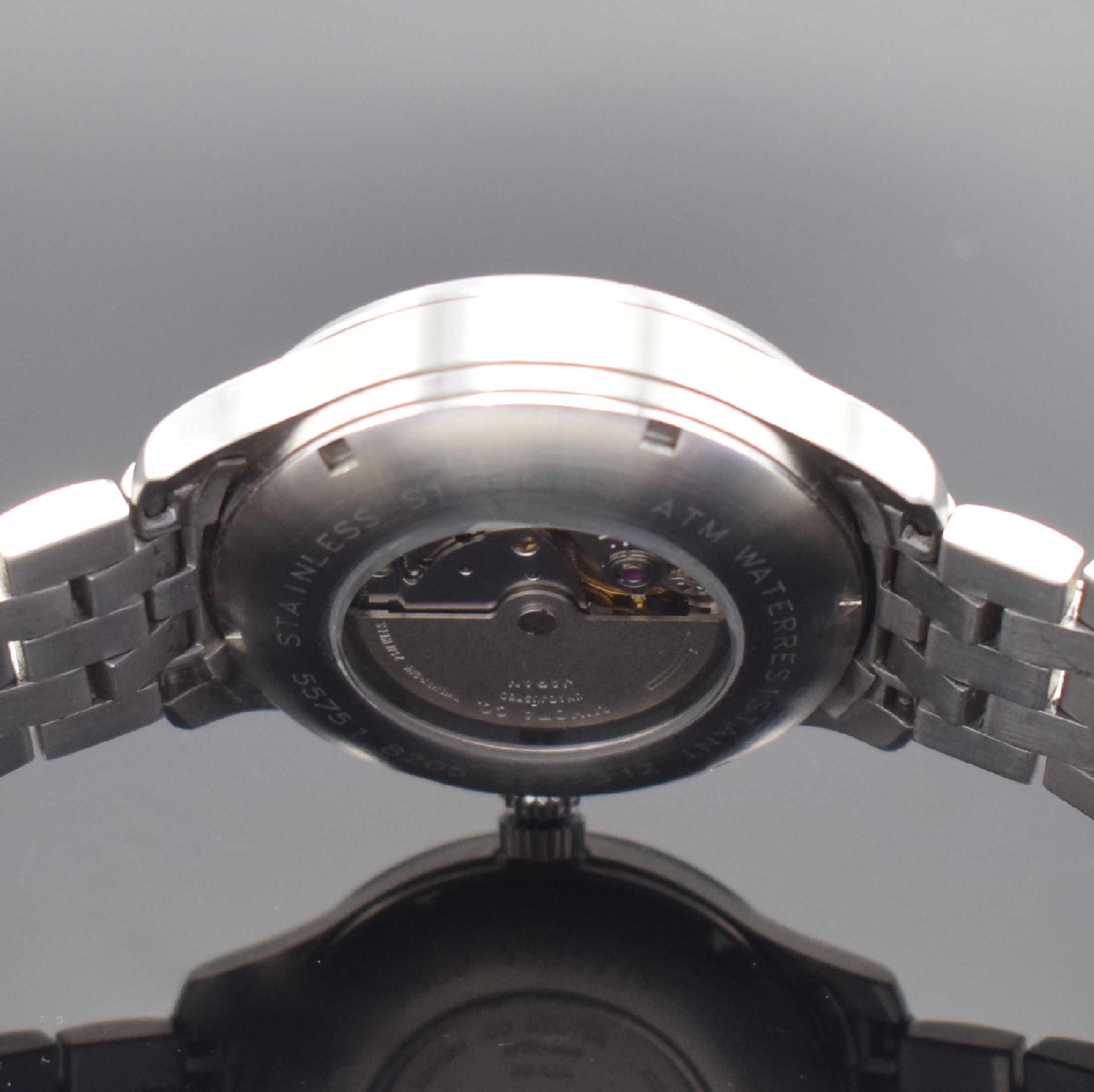 Detail e: DUGENA Herrenarmbanduhr, Automatik, Edelstahlgeh. inkl. orig. Gliederband m. Faltschl., beids. vergl., Boden verschr., schwarzes Kontrastzifferbl., ...