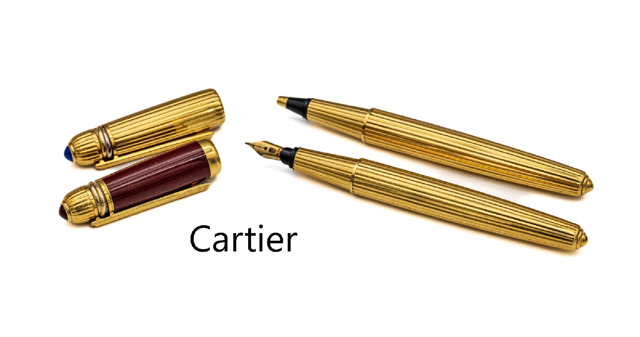 CARTIER Konvolut best. aus: Füller und Kugelschreiber, aus der Serie "Pasha de Cartier", 18 kt GG Feder, Kappe mit rotem Hartlack, ...