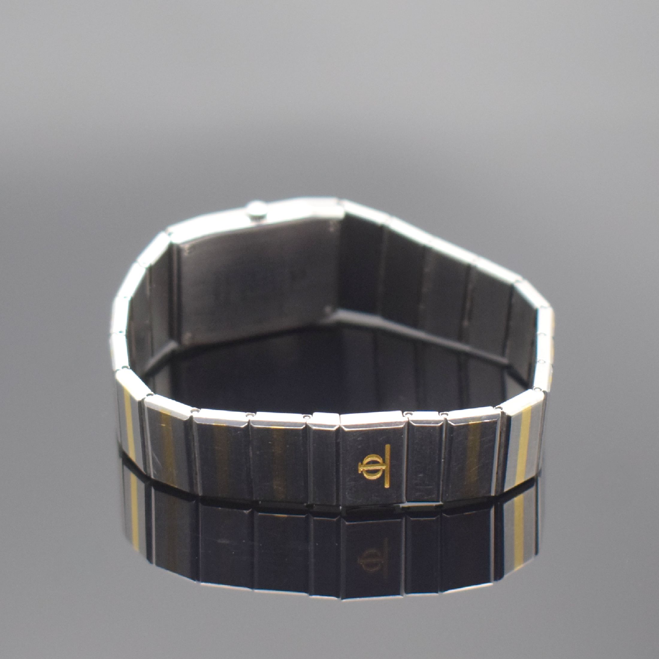 Detail b: BAUME & MERCIER Damenarmbanduhr, Schweiz um 1995, quarz, Edelstahl/Gold komb., Boden 4- fach verschr., orig. Gliederband, silb. Zifferbl. m. gold. ...