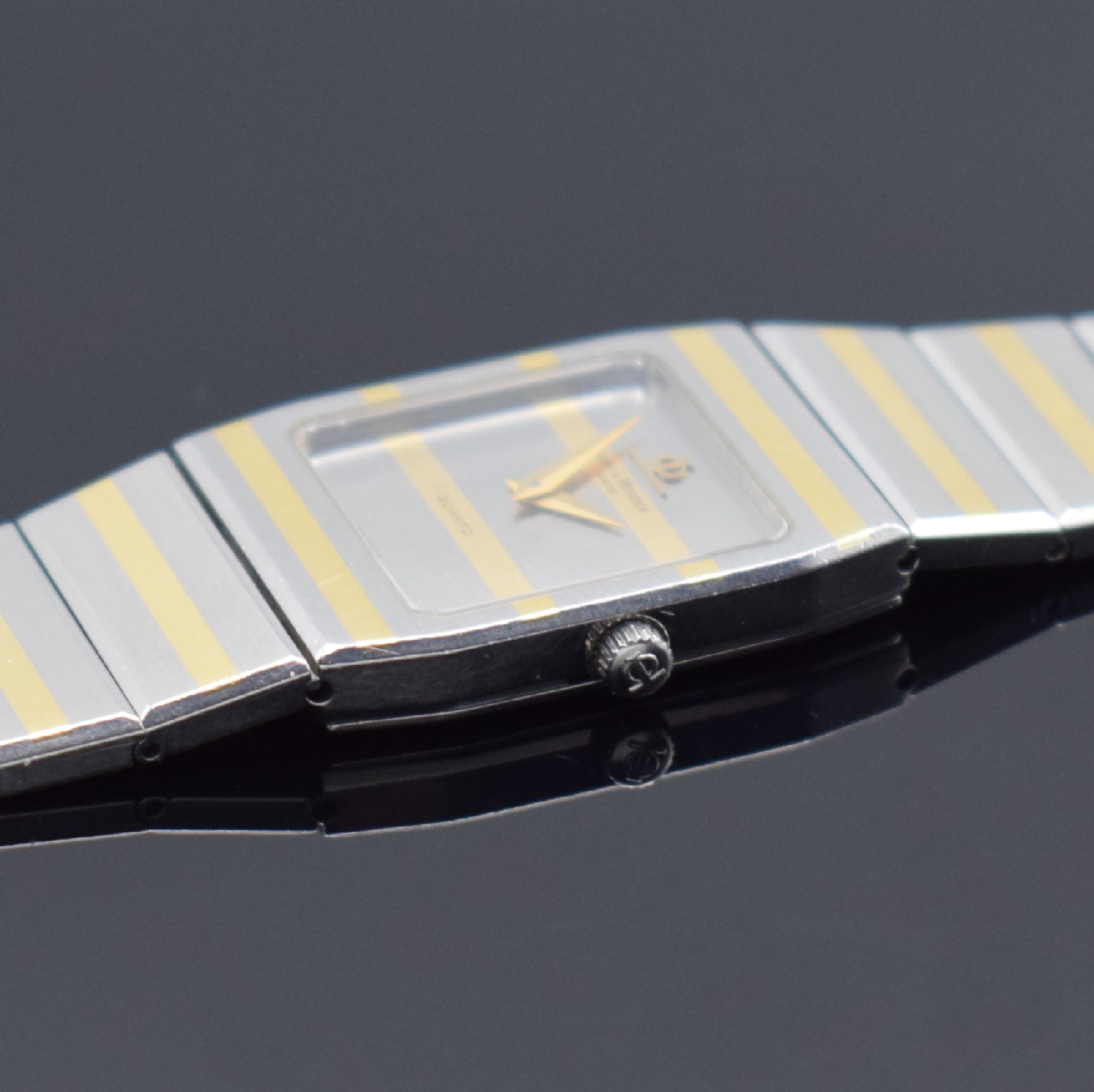 Detail c: BAUME & MERCIER Damenarmbanduhr, Schweiz um 1995, quarz, Edelstahl/Gold komb., Boden 4- fach verschr., orig. Gliederband, silb. Zifferbl. m. gold. ...