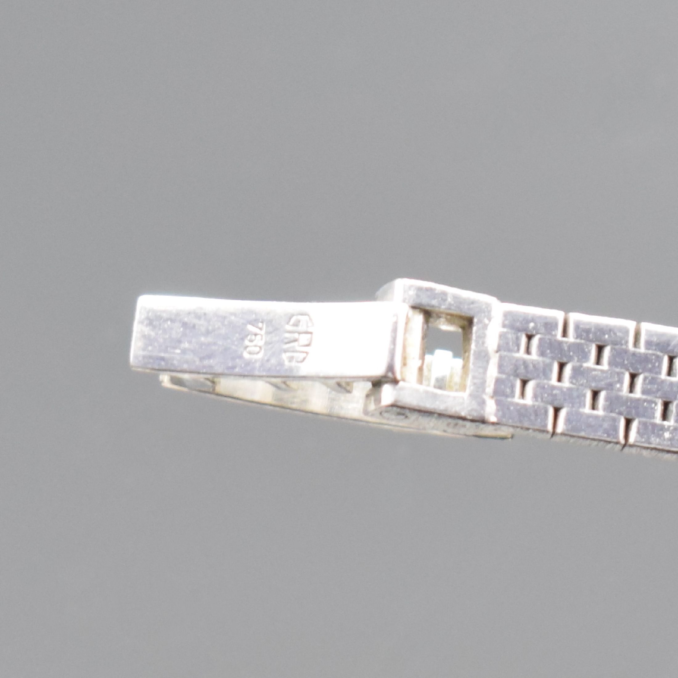 Detail c: CORUM Damenarmbanduhr in WG 750/000, Schweiz um 1965, Handaufzug, Boden aufgedr., inkl. Band in WG 750/000, Lünette aufw. m. Diamanten bes. zus. ca. ...