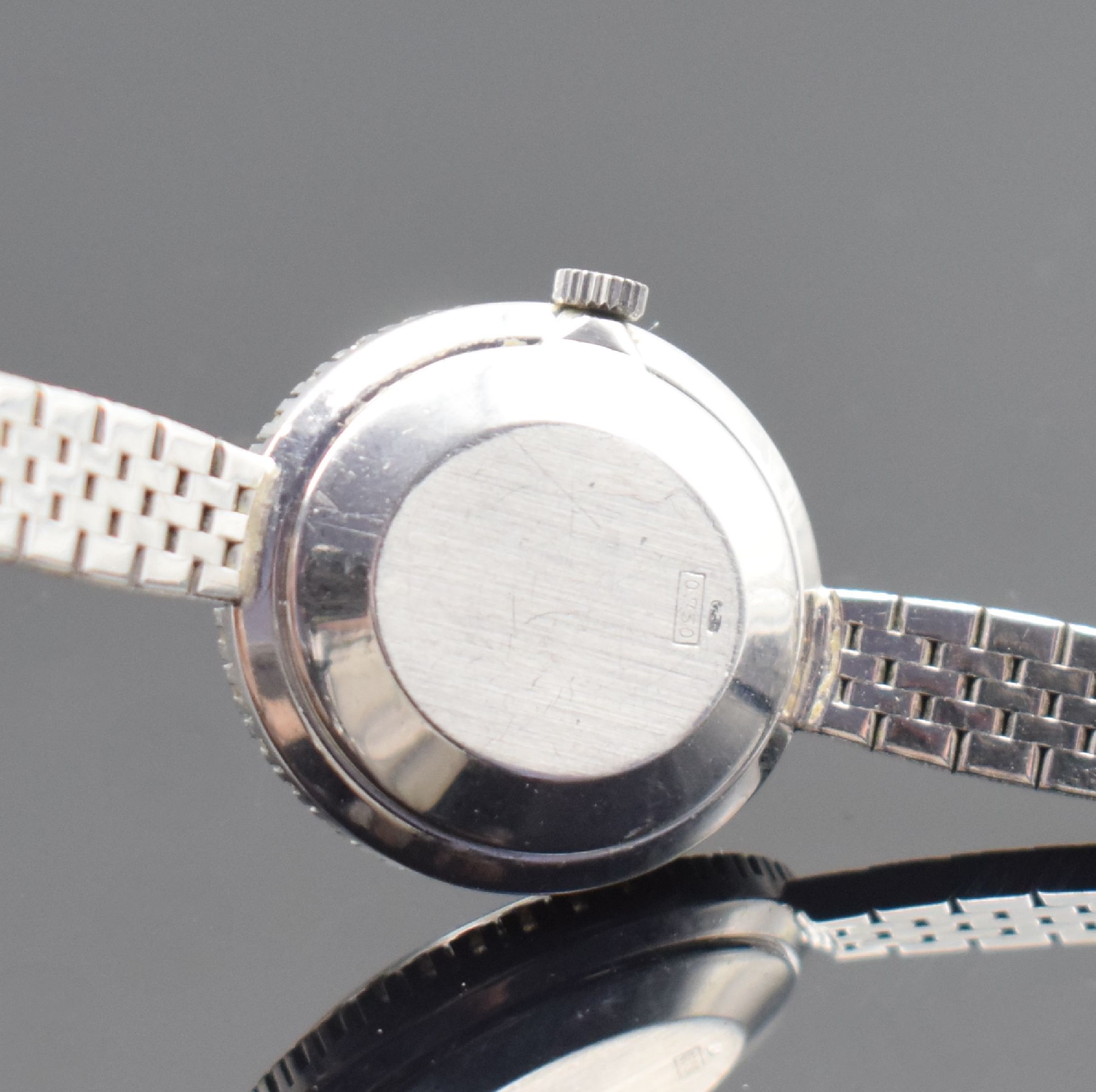 Detail d: CORUM Damenarmbanduhr in WG 750/000, Schweiz um 1965, Handaufzug, Boden aufgedr., inkl. Band in WG 750/000, Lünette aufw. m. Diamanten bes. zus. ca. ...