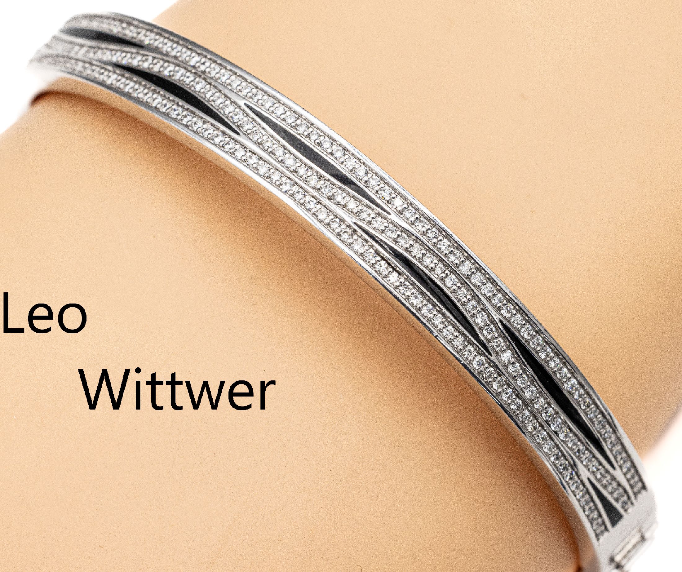 18 kt Gold LEO WITTWER Brillant-Armreif mit Email, WG 750/000, 3-reihig bes. mit Brillanten zus. ca. 0.93 ct feines Weiß-Weiß/ vs-si, z.T. schwarz ...