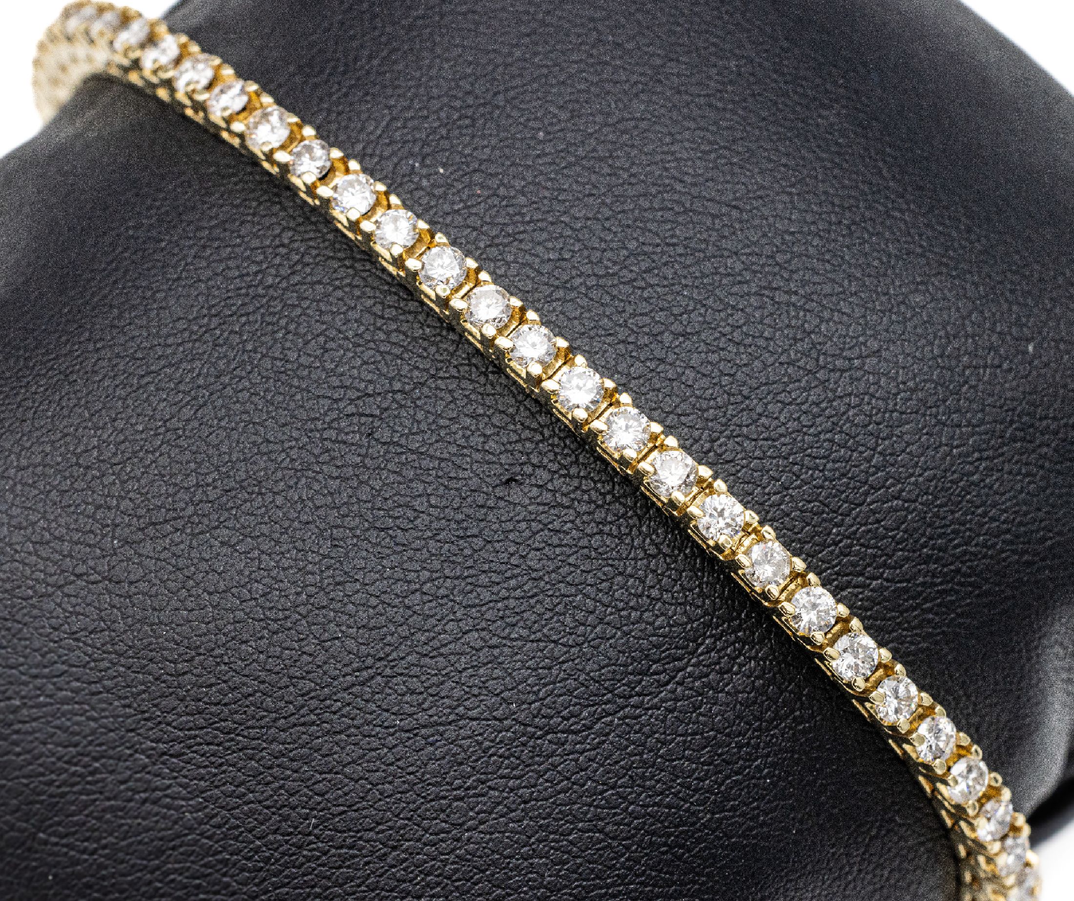 14 kt Gold Brillant-Linienarmband, GG 585/000, 52 Brillanten zus. ca. 3.30 ct Weiß/si, L. ca. 17.5 cm, ca. 13 g, Kastenschloß mit Sicherheitsacht