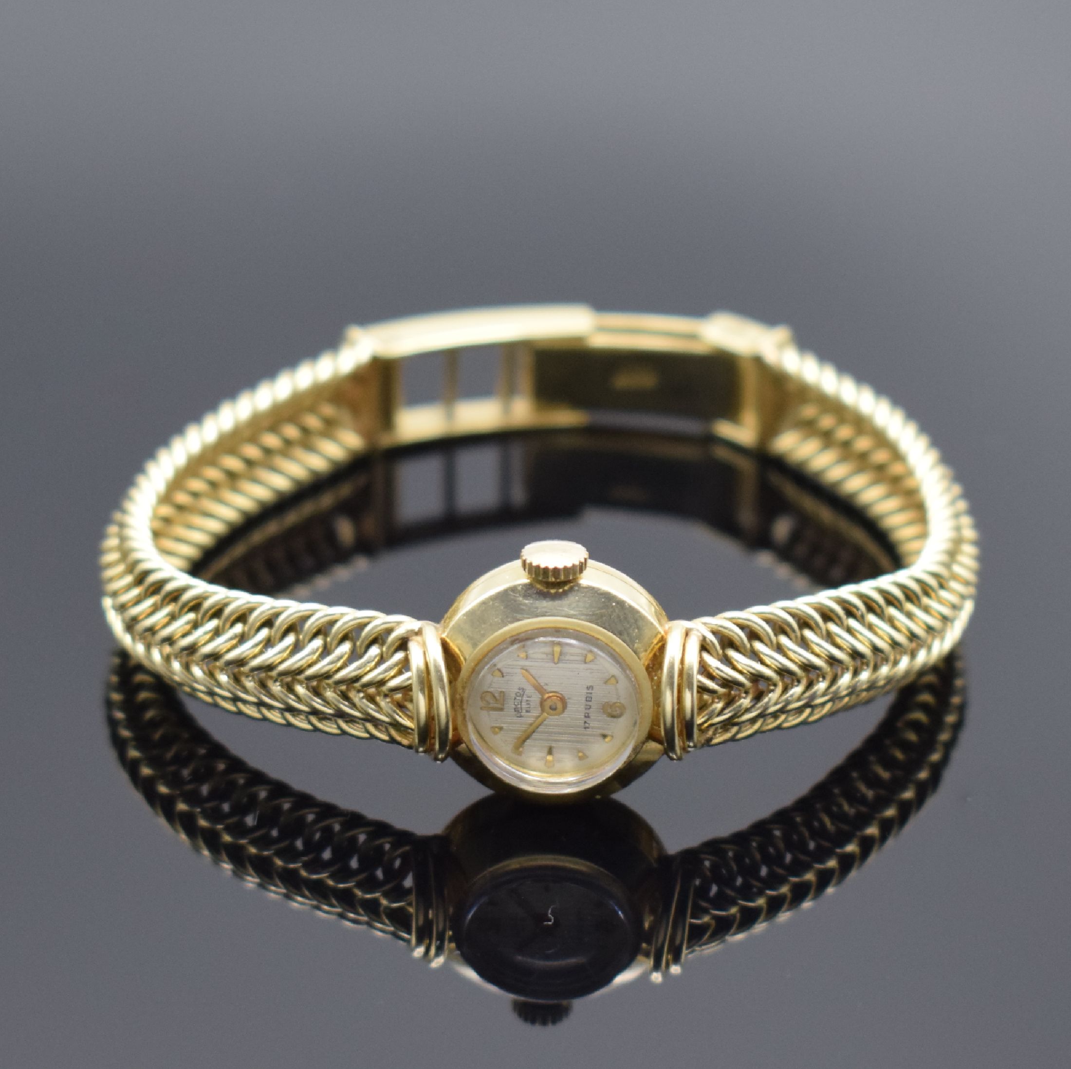 ARCTOS Damenarmbanduhr in GG 585/000, Schweiz um 1970, quarz, Boden aufgedr., silb. strukt. Zifferbl. m. gold. Std.-Ind. und Zeigern, D. ca. 17 mm, ...