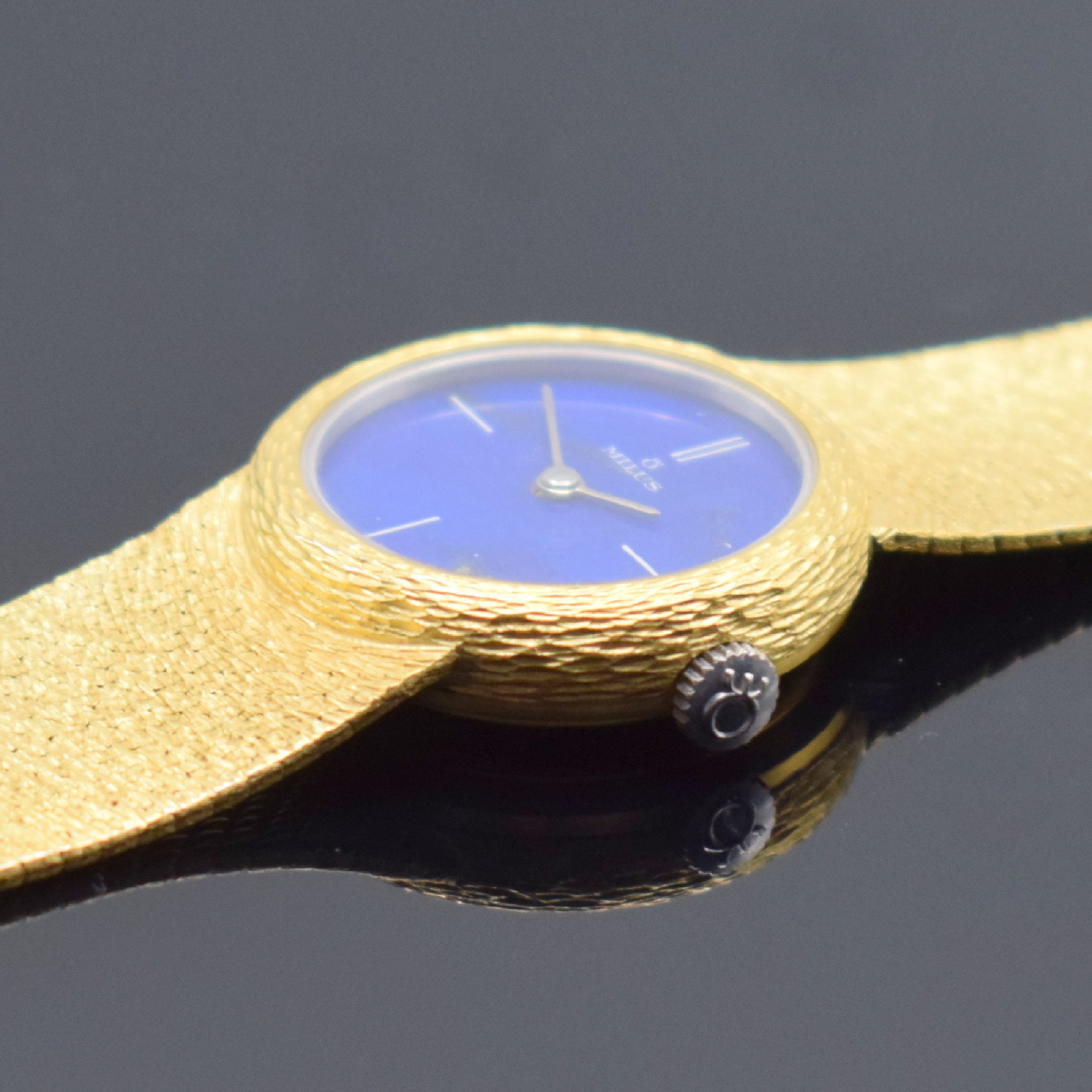 Detail b: MILUS Damenarmbanduhr in GG 750/000, Schweiz um 1965, Handaufzug, GG 750/000 Band, Boden aufgedr., Lapislazuli-Zifferbl. riss., gold. Zeiger, sign. ...
