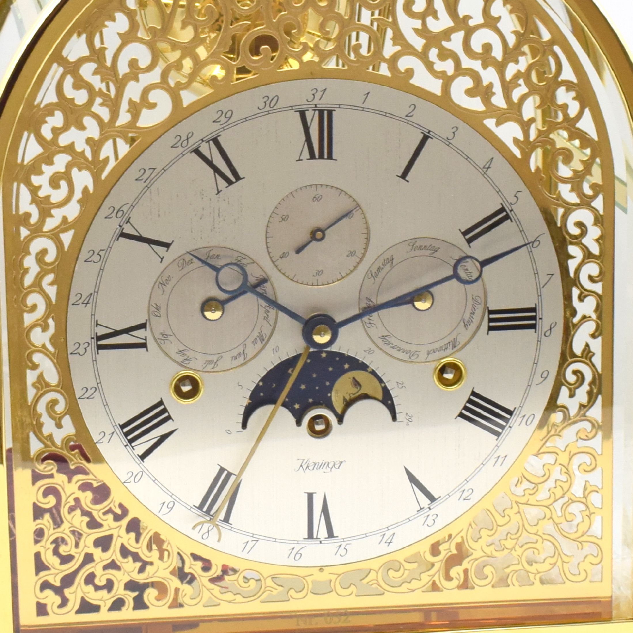 Detail a: KIENINGER seltene, verglaste Tischuhr mit Vollkalenderanzeige und 1/4-Schlag auf 9 Glocken mit 3 Melodien, Deutschland um 1990, 5-seitig ...