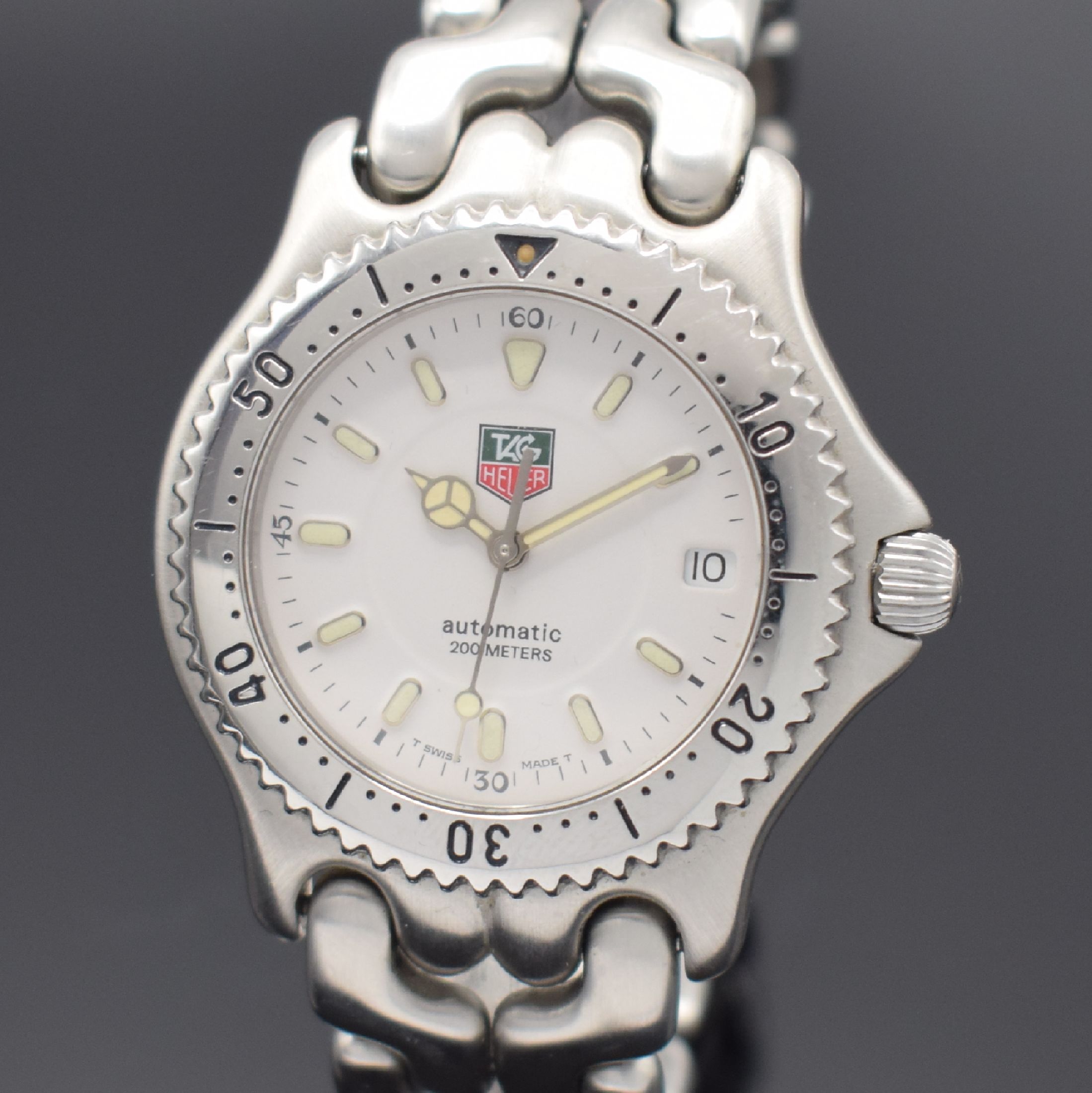 Detail a: TAG HEUER Herrenarmbanduhr Referenz S89.706, Schweiz um 1995, Automatik, Edelstahlgeh. inkl. Gliederband mit Faltschl., Boden und Krone verschr., ...