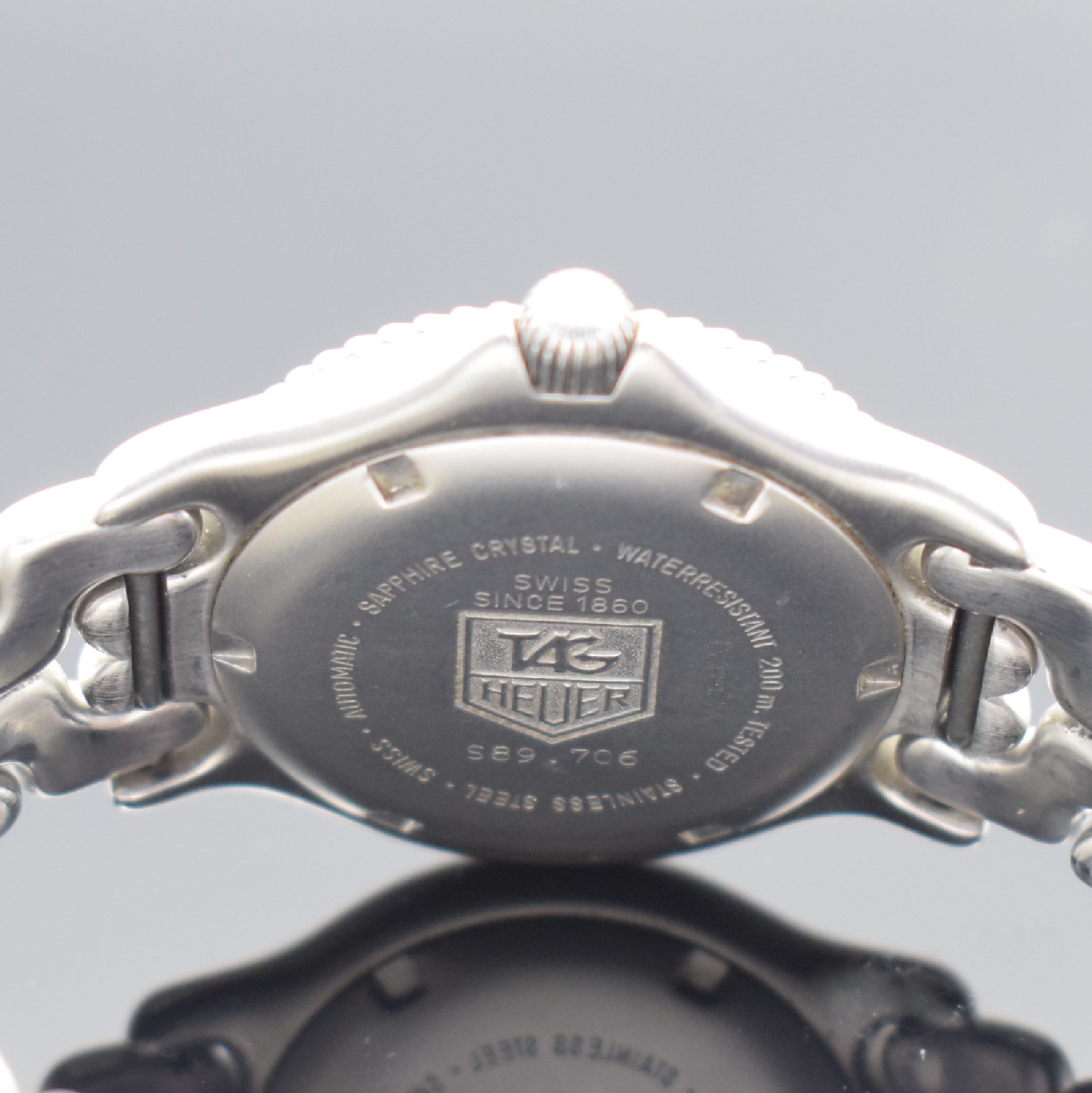 Detail d: TAG HEUER Herrenarmbanduhr Referenz S89.706, Schweiz um 1995, Automatik, Edelstahlgeh. inkl. Gliederband mit Faltschl., Boden und Krone verschr., ...