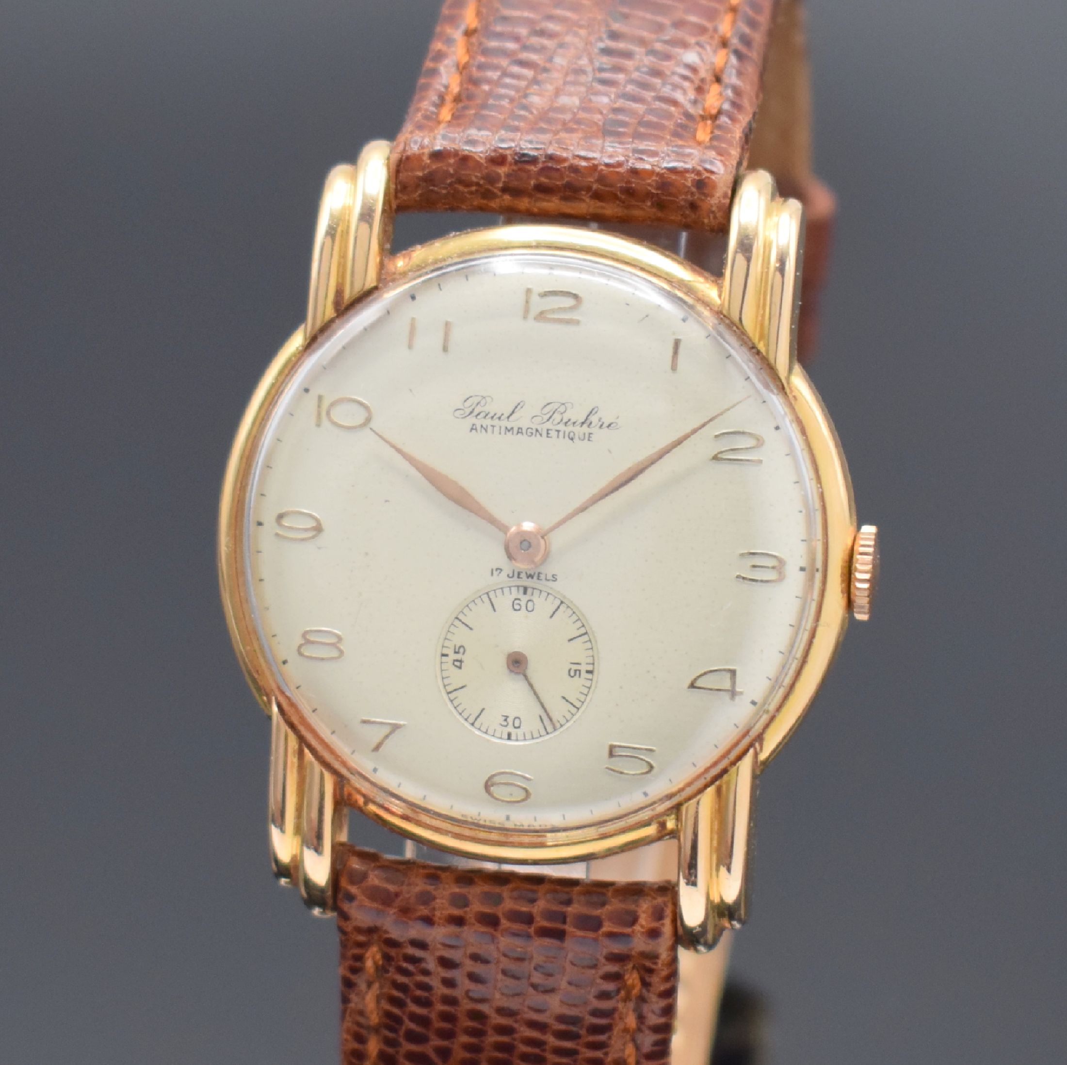 Detail a: PAUL BUHRE Herrenarmbanduhr in RG 750/000, Schweiz um 1945, Handaufzug, 2-tlg. Geh. m. ausgefallenen Anstößen, Boden aufgedr., silb. Zifferbl. fl., ...