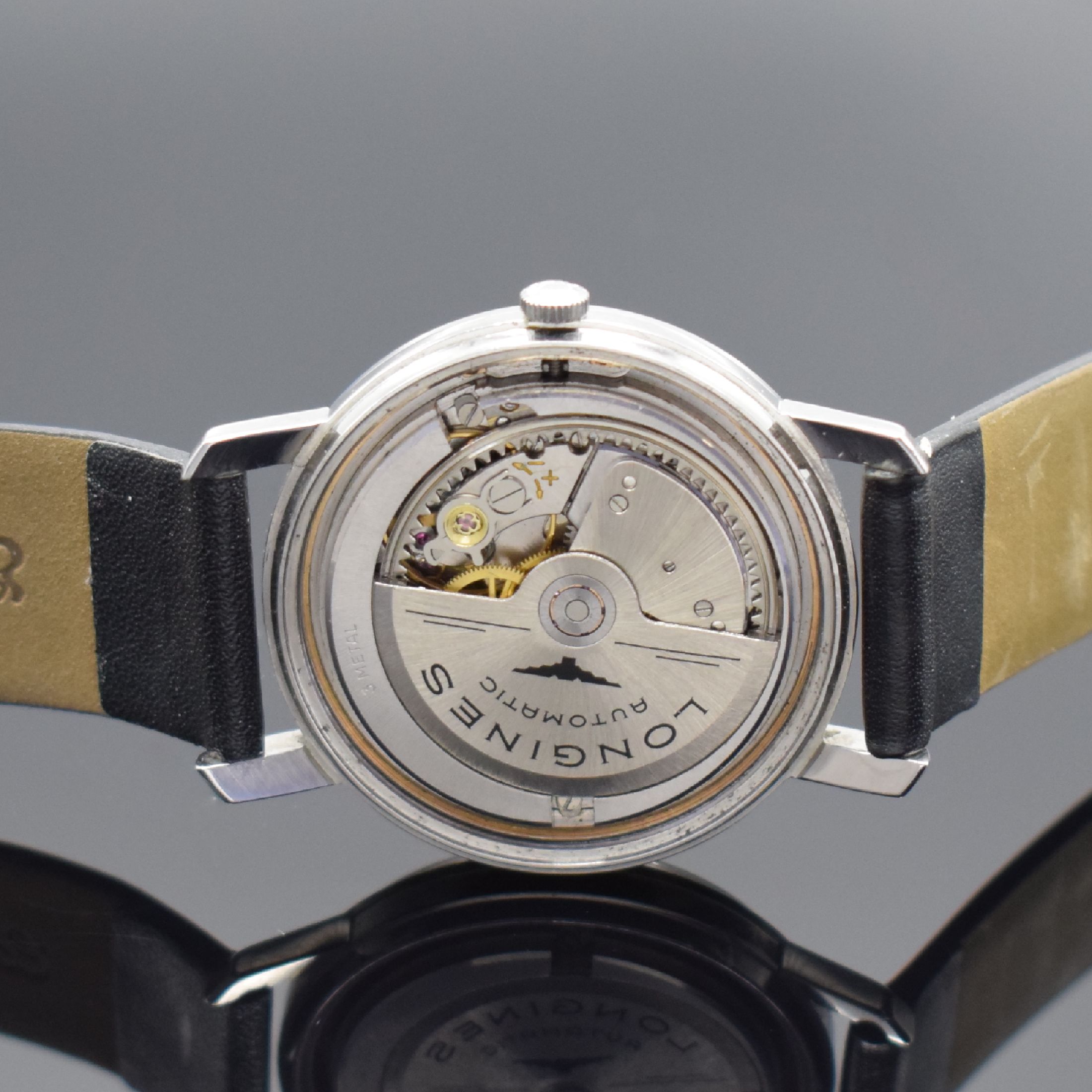 Detail d: LONGINES Flagship Herrenarmbanduhr in Stahl, Schweiz um 1962, Automatik, verschr. Geh., Boden m. Goldplakette, orig. Krone, silb. Zifferbl., aufges. ...