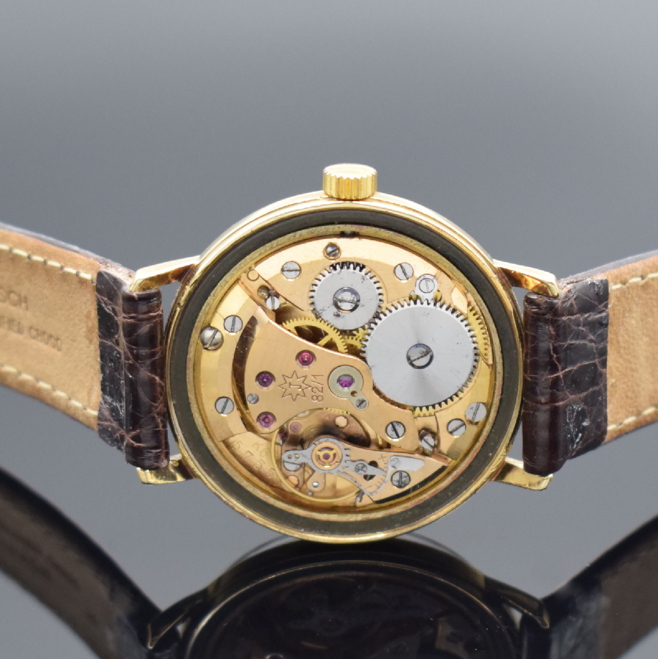Detail d: JUNGHANS Chronometer Armbanduhr in GG 585/000, Deutschland um 1956, Handaufzug, verschr. Geh., silb. Schraffur-Zifferbl., gold. Indices, gold. ...