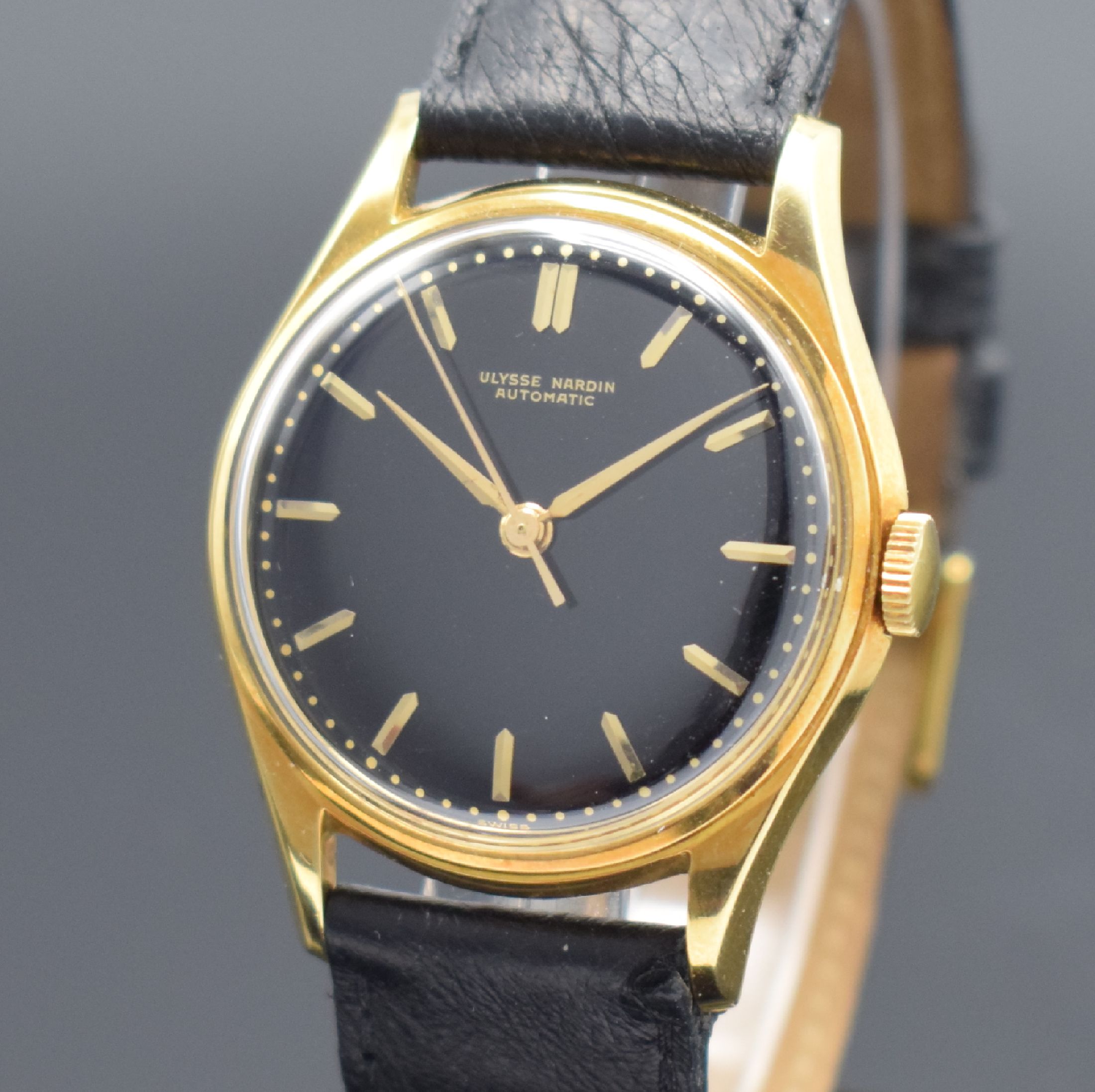 Detail a: ULYSSE NARDIN Herrenarmbanduhr in GG 750/000, Schweiz um 1960, Automatik, 3-tlg. Geh., Boden und Glasrand aufgedr., wunderbares schwarzes ...