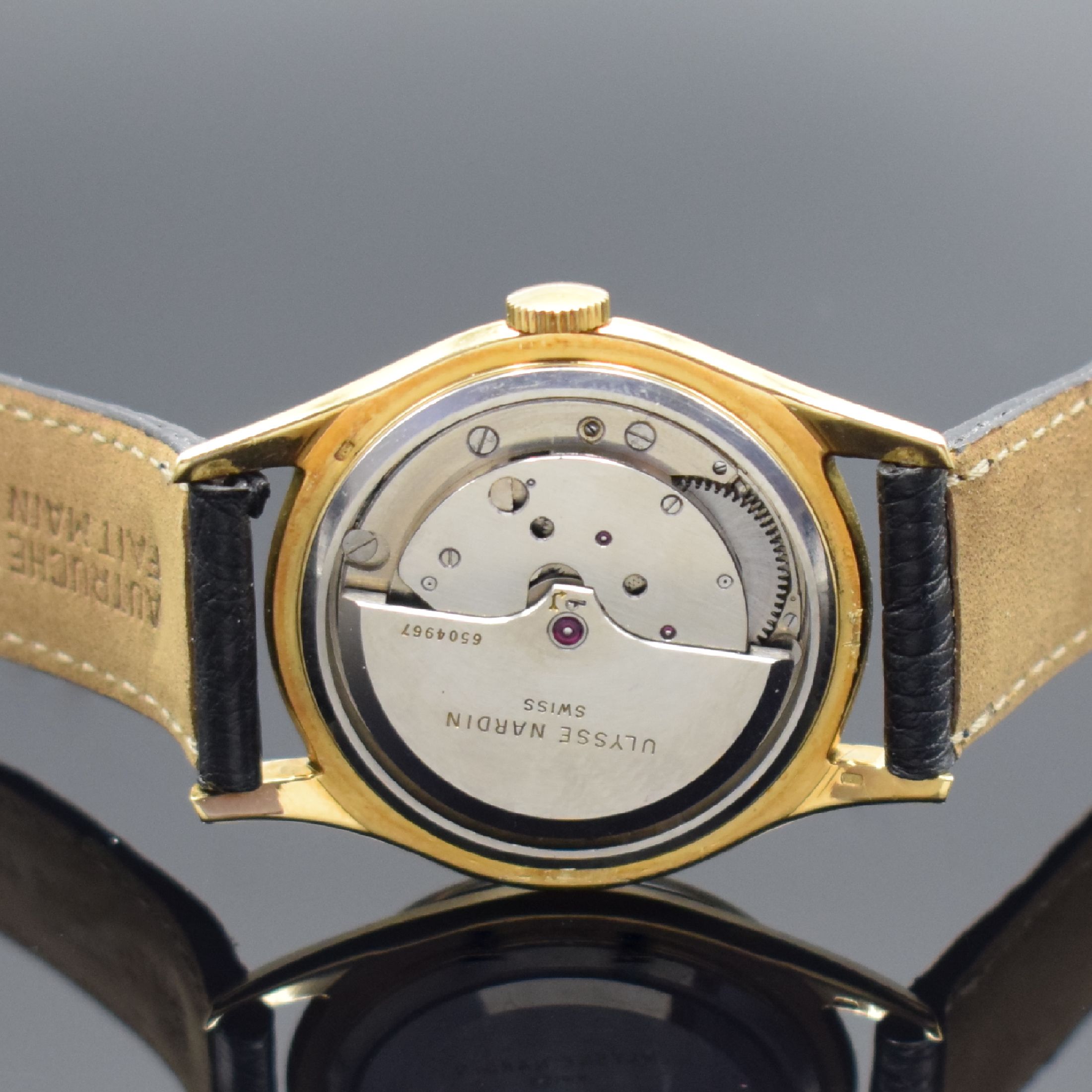 Detail d: ULYSSE NARDIN Herrenarmbanduhr in GG 750/000, Schweiz um 1960, Automatik, 3-tlg. Geh., Boden und Glasrand aufgedr., wunderbares schwarzes ...