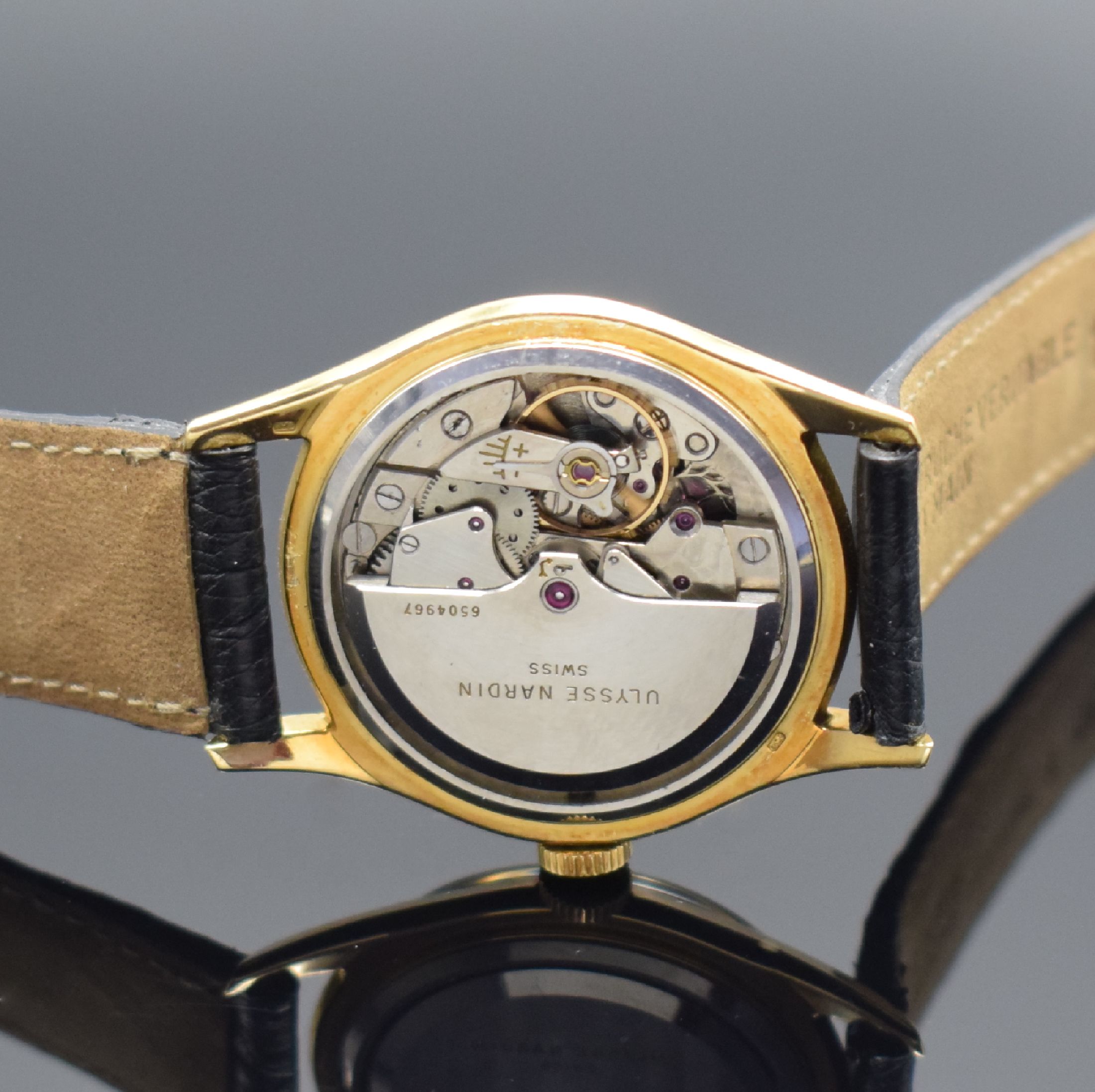 Detail e: ULYSSE NARDIN Herrenarmbanduhr in GG 750/000, Schweiz um 1960, Automatik, 3-tlg. Geh., Boden und Glasrand aufgedr., wunderbares schwarzes ...
