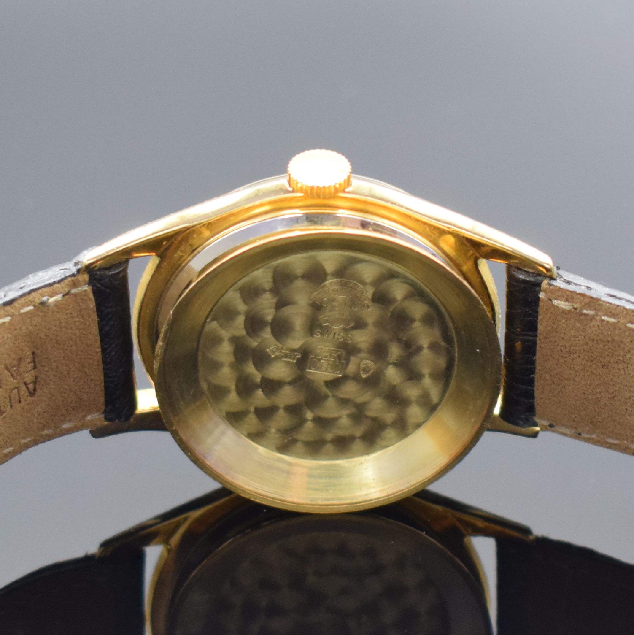 Detail f: ULYSSE NARDIN Herrenarmbanduhr in GG 750/000, Schweiz um 1960, Automatik, 3-tlg. Geh., Boden und Glasrand aufgedr., wunderbares schwarzes ...