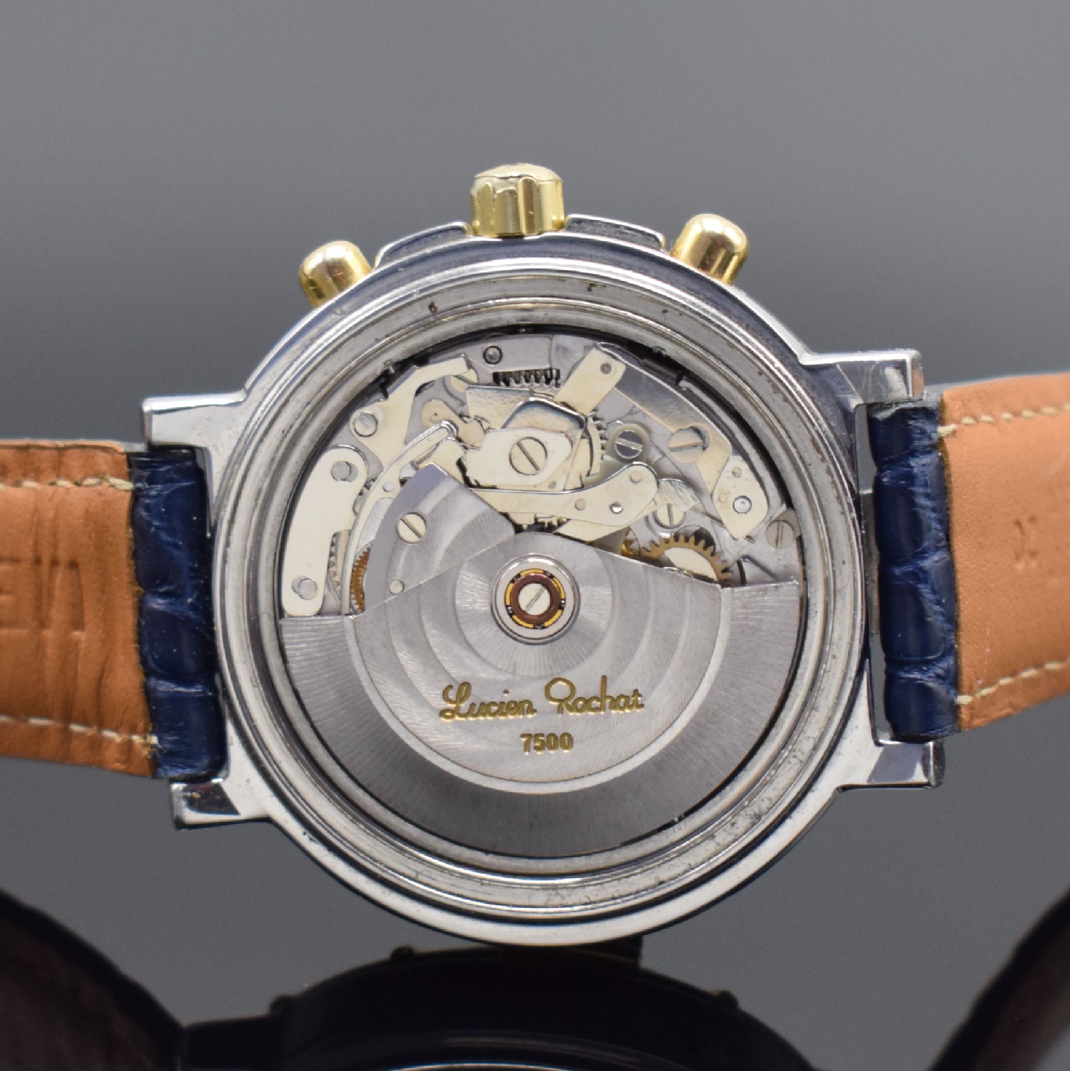 Detail d: LUCIEN ROCHAT Herrenchronograph mit Voll- Kalender in Stahl, Schweiz um 1990, Automatik, Geh. m. eins. drehb. Lunette, einges. Gold-Indexe, Boden u. ...